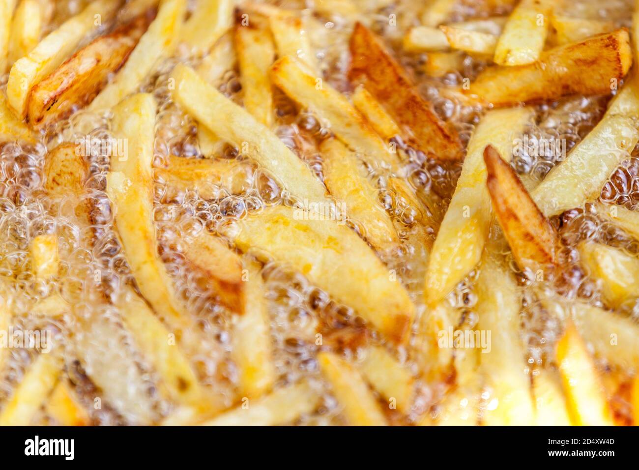 homemade french fries in hot oil Stock Photo Alamy