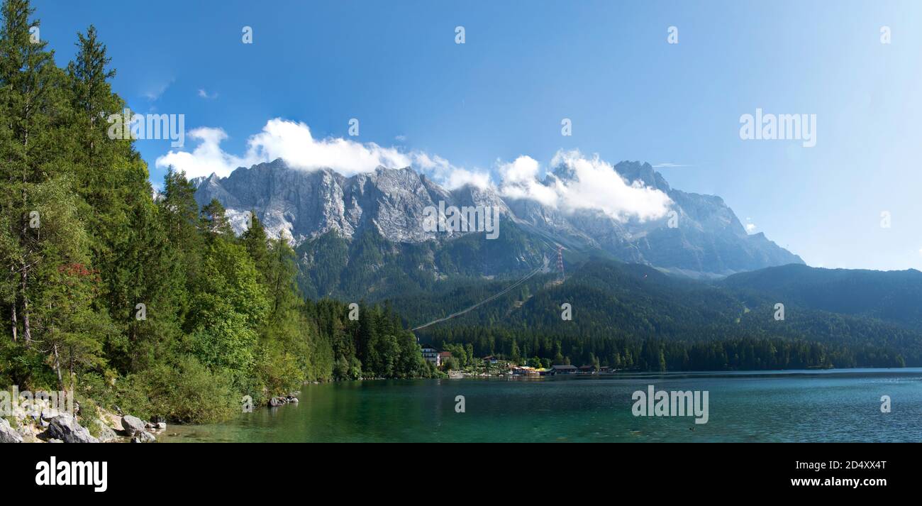 View of Zugspitze Mountains seen from the bank of Lake Eibsee Stock Photo