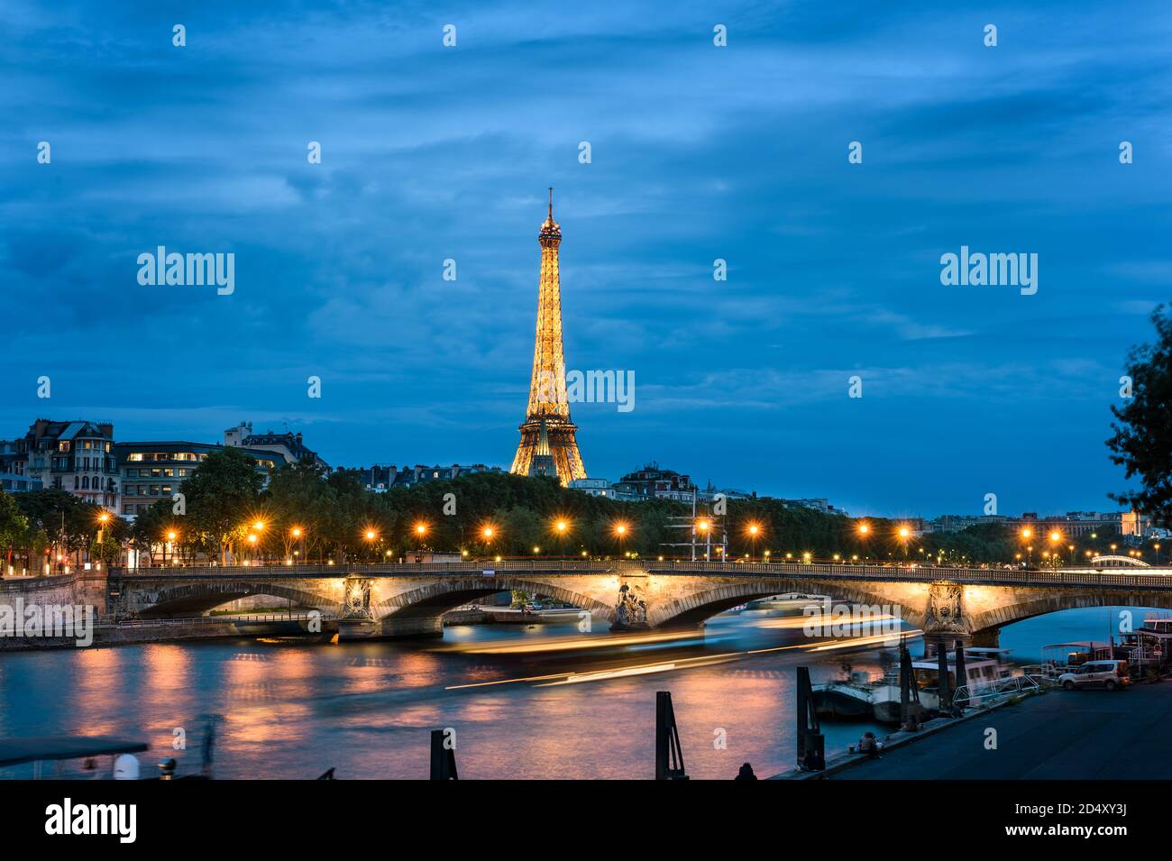 JUNE 06, 2017 PARIS, ILE DE FRANCE, FRANCE : Ile de la Cite and the eiffel tower with lights at the end of the day, at dusk, Paris, France Stock Photo