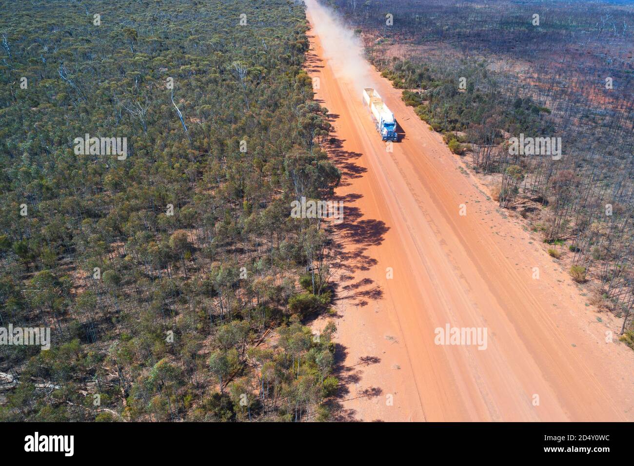 Road train truck on dusty outback road, seen from the air, Hyden Noresman road, Western Australia Stock Photo