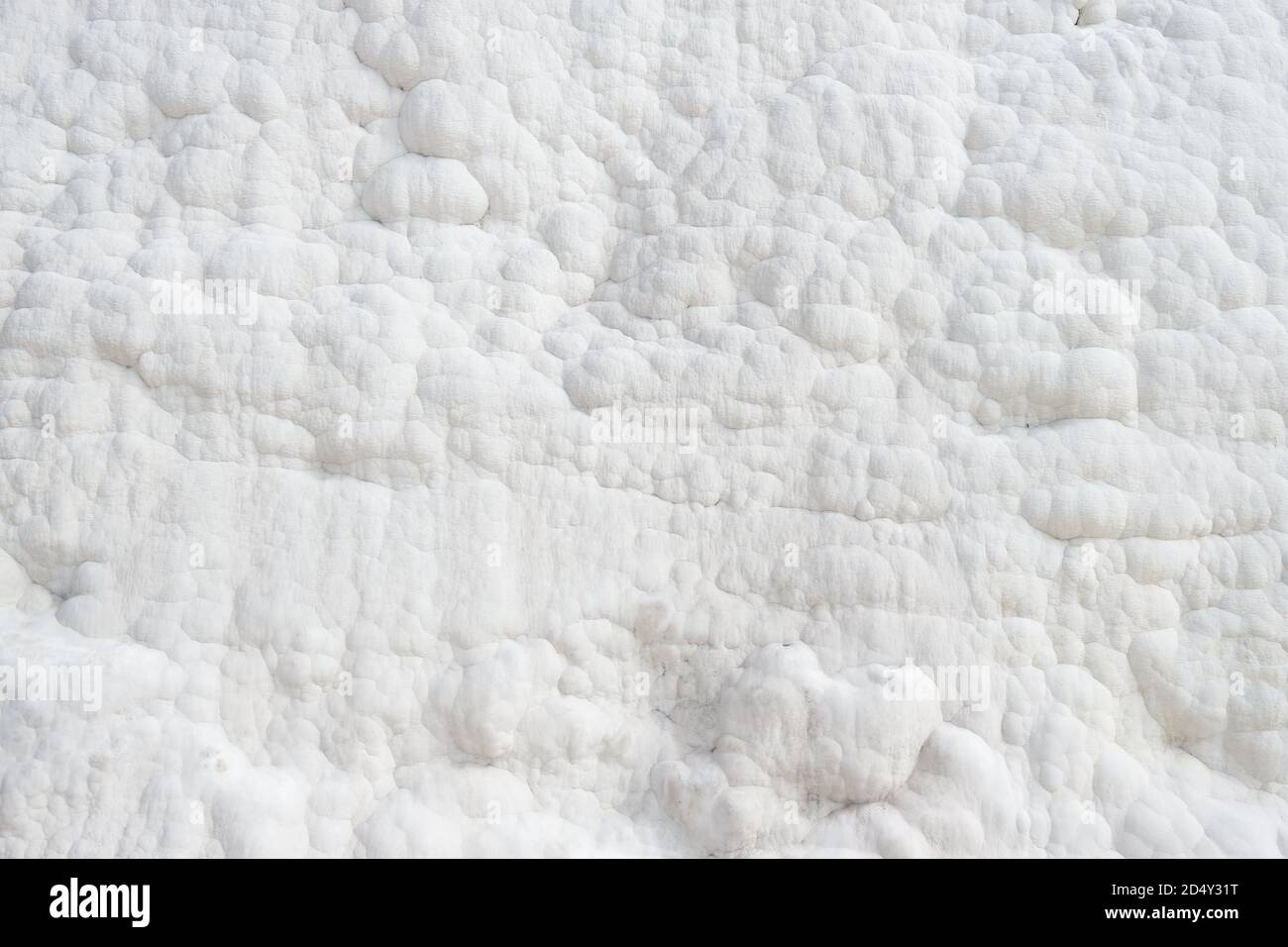 White calcium deposits on the slopes of Pamukkale, Turkey Stock Photo
