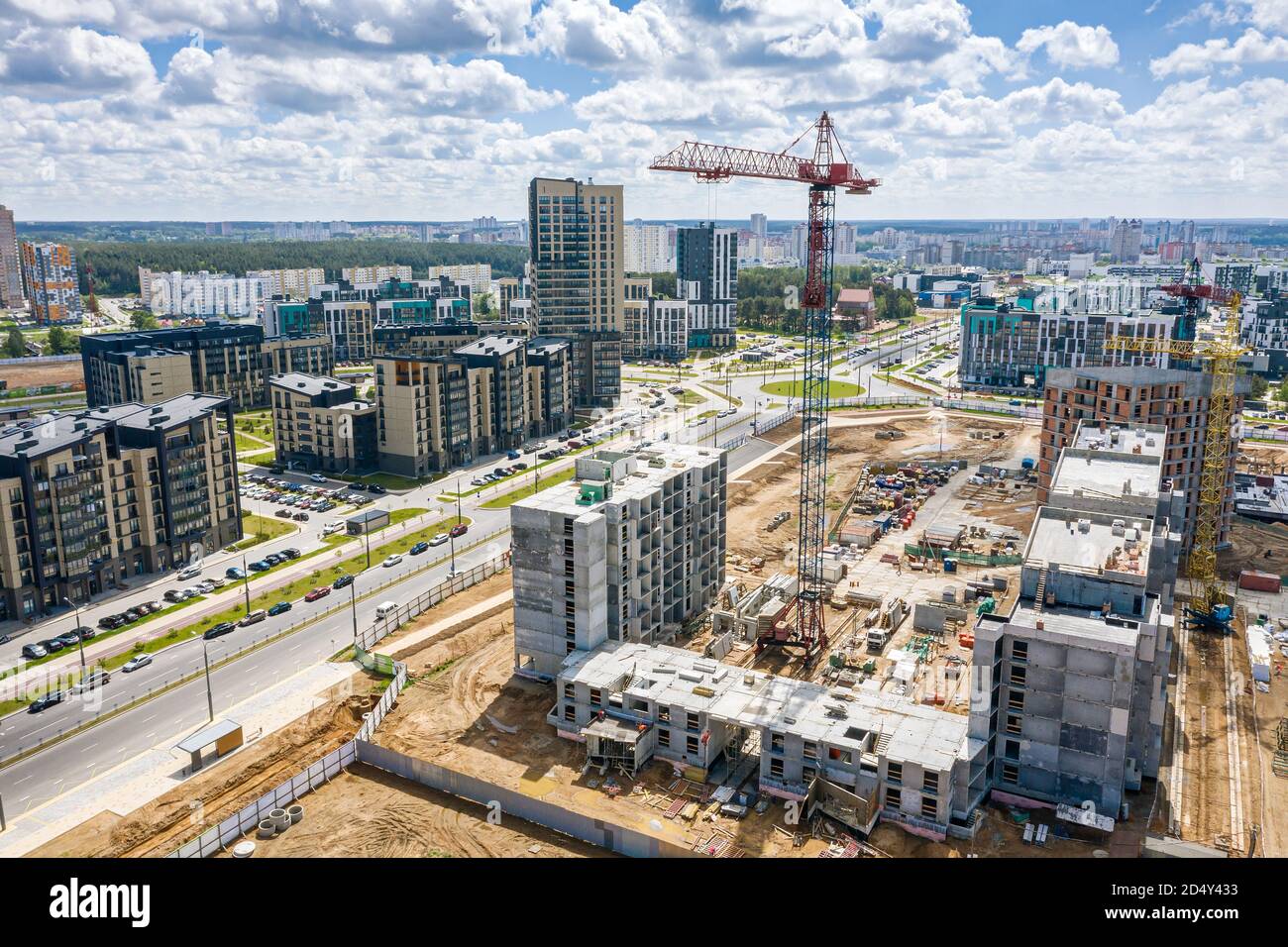 aerial view of construction site of a new residential area with tower cranes Stock Photo