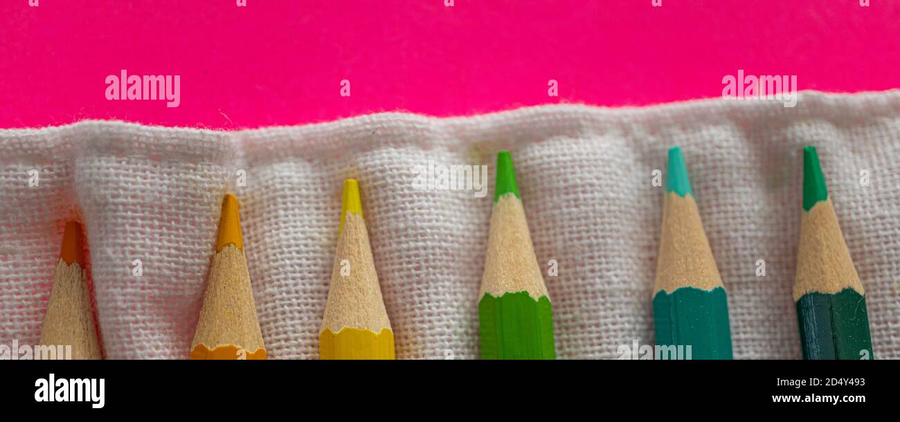 Coloring pencils wrapped in a cloth linen bag - Banner Stock Photo