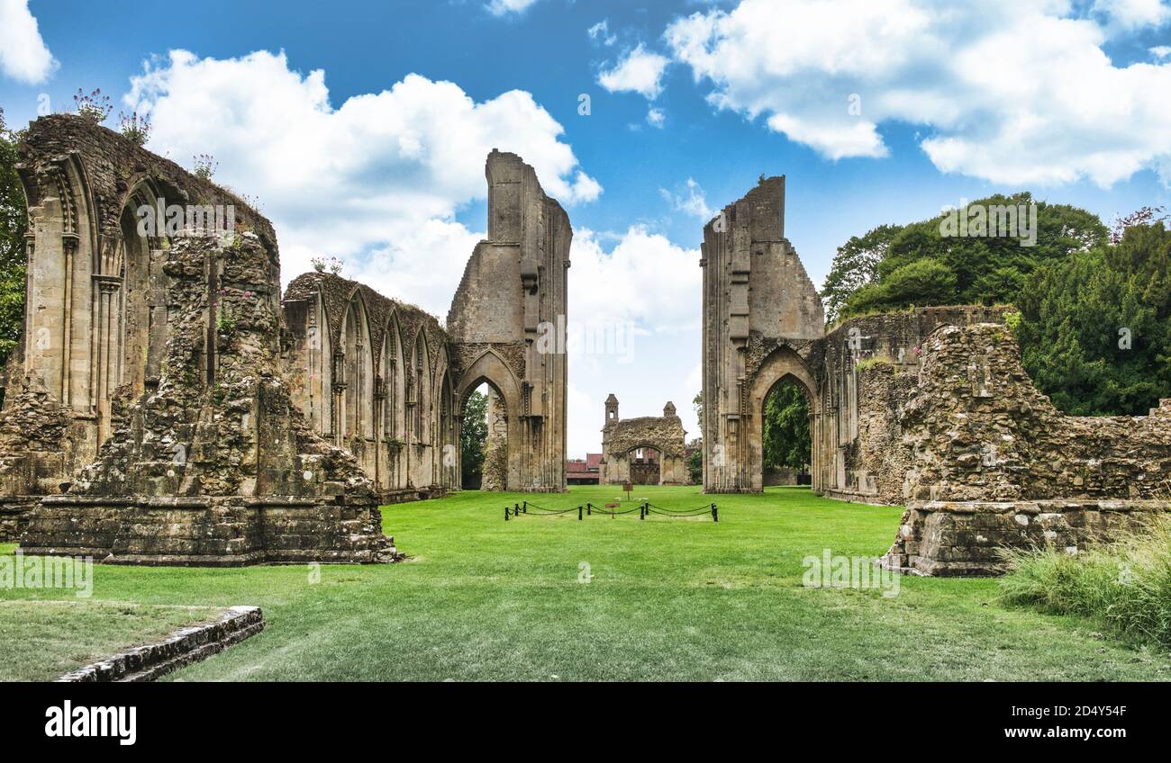 Glastonbury Abbey ruins looking down the Great Church east end, crossing and nave. King Arthur and Queen Guinevere proclaimed grave site center frame. Stock Photo
