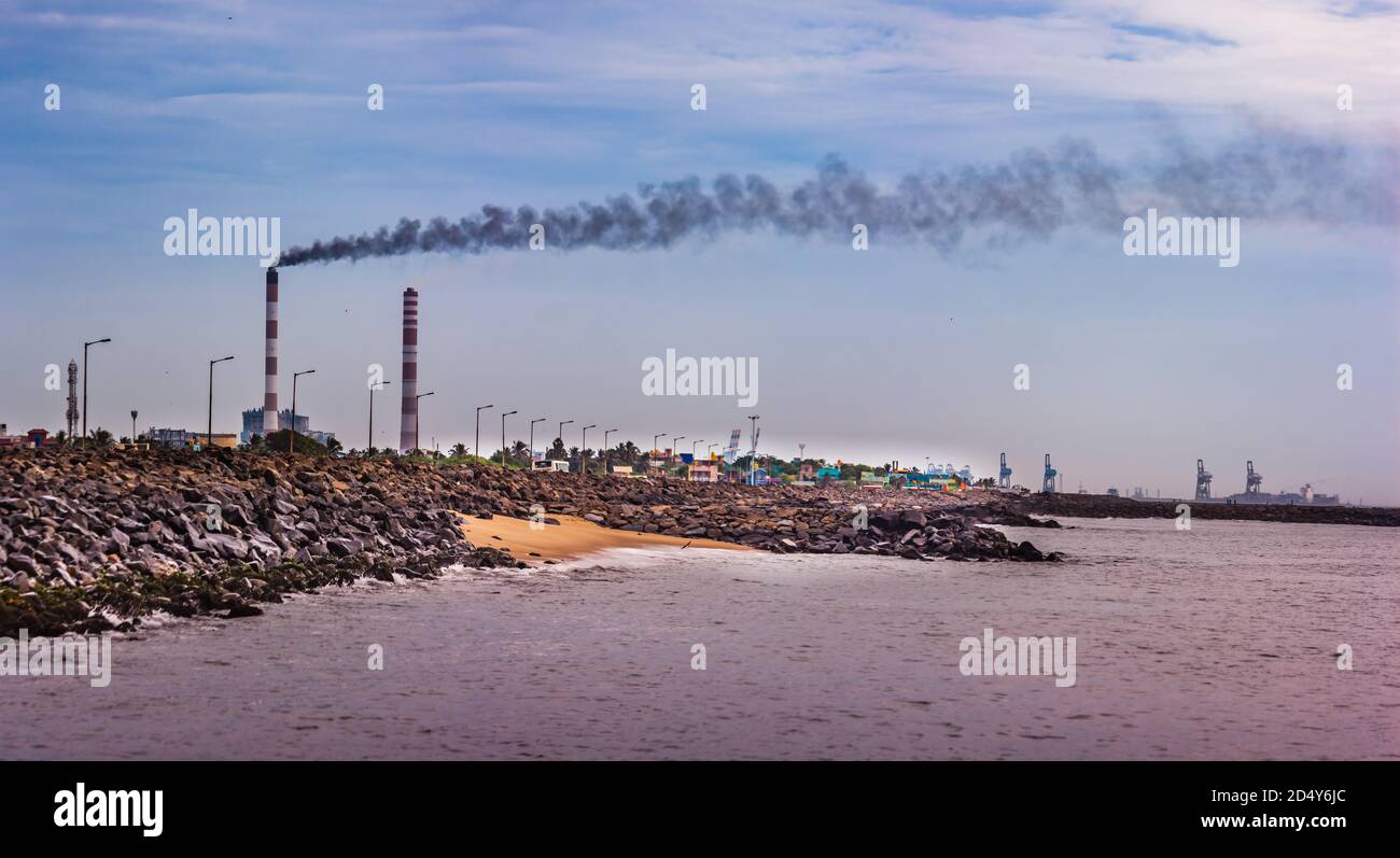 Industrial landscape - Smoke from the pipes of heat station with carry out harmful emissions.Petrochemical factory chimney.Its held to increasing Glob Stock Photo