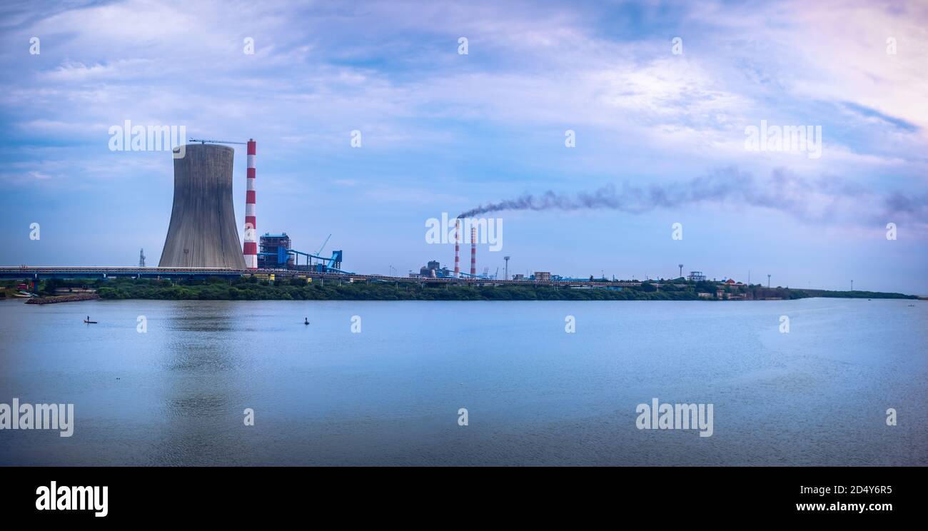 Industrial landscape Smoke from the pipes of heat station with carry