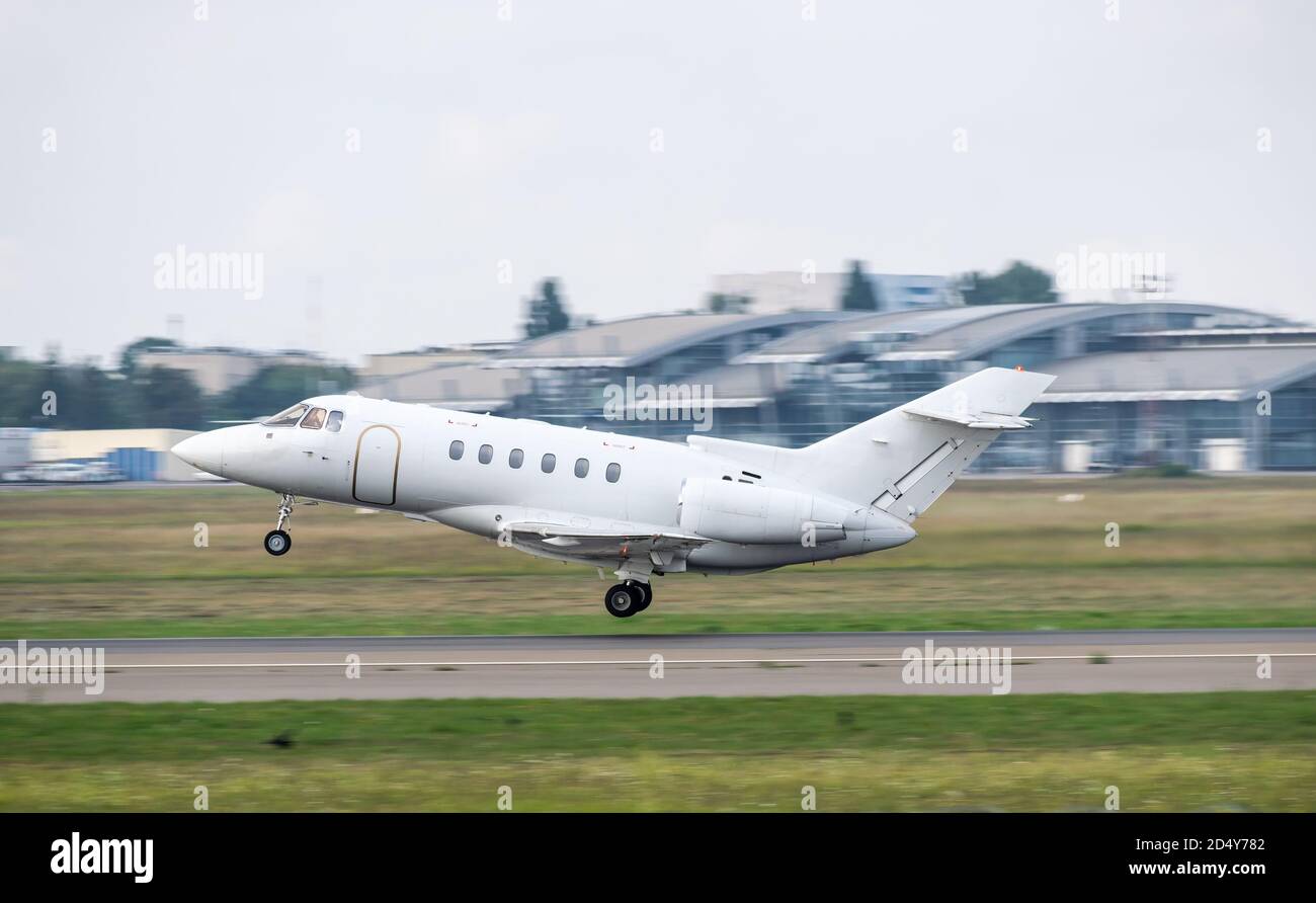 Business jet is taking off from the airport Stock Photo - Alamy