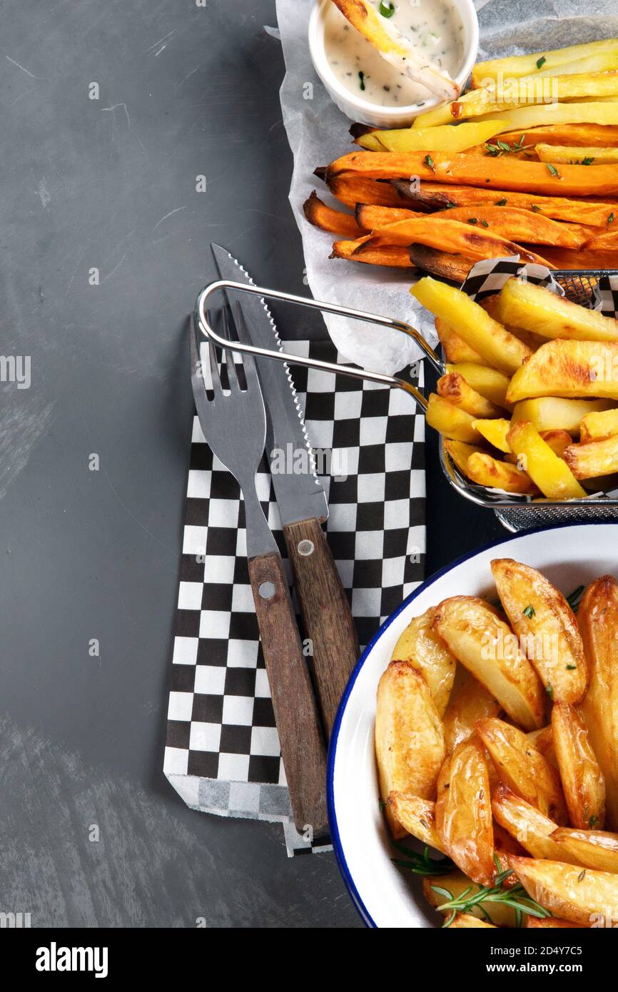 Different types of fried potato . Potato wedges, french fries, sweet