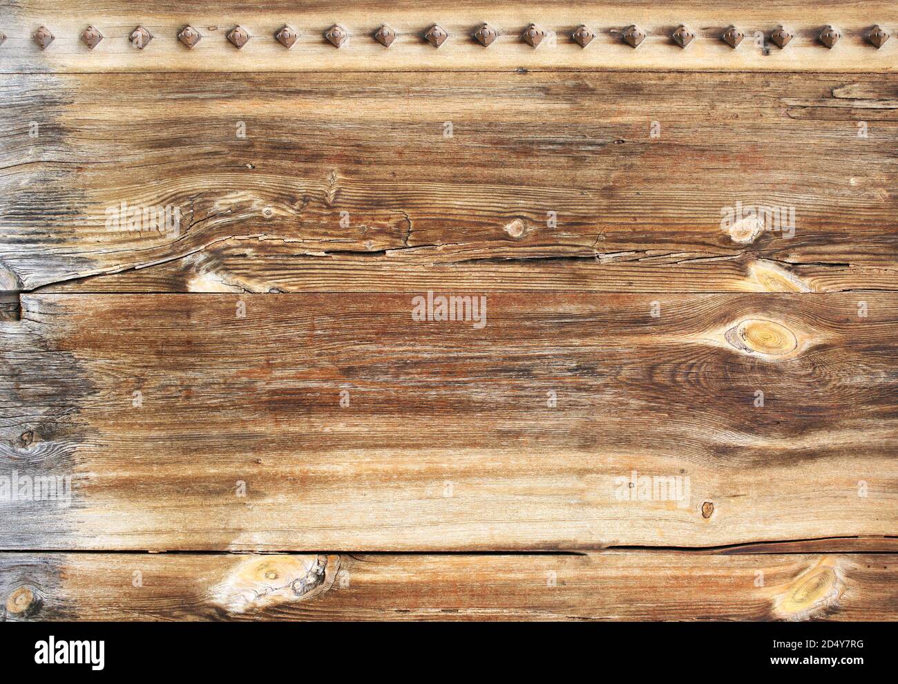 Horizontal or vertical texture of ancient wood with metal rivets. Mock ...