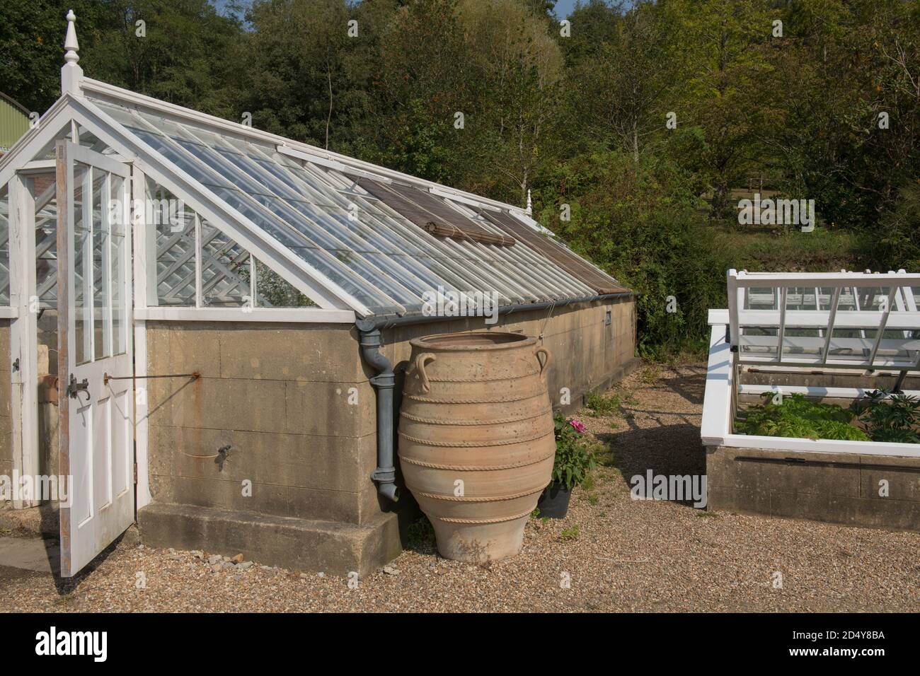Decorative Terracotta Pot by the Side of a Traditional Stone Greenhouse