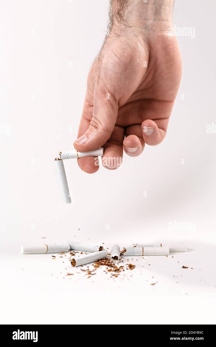 Cigarette broken hand hi-res stock photography and images