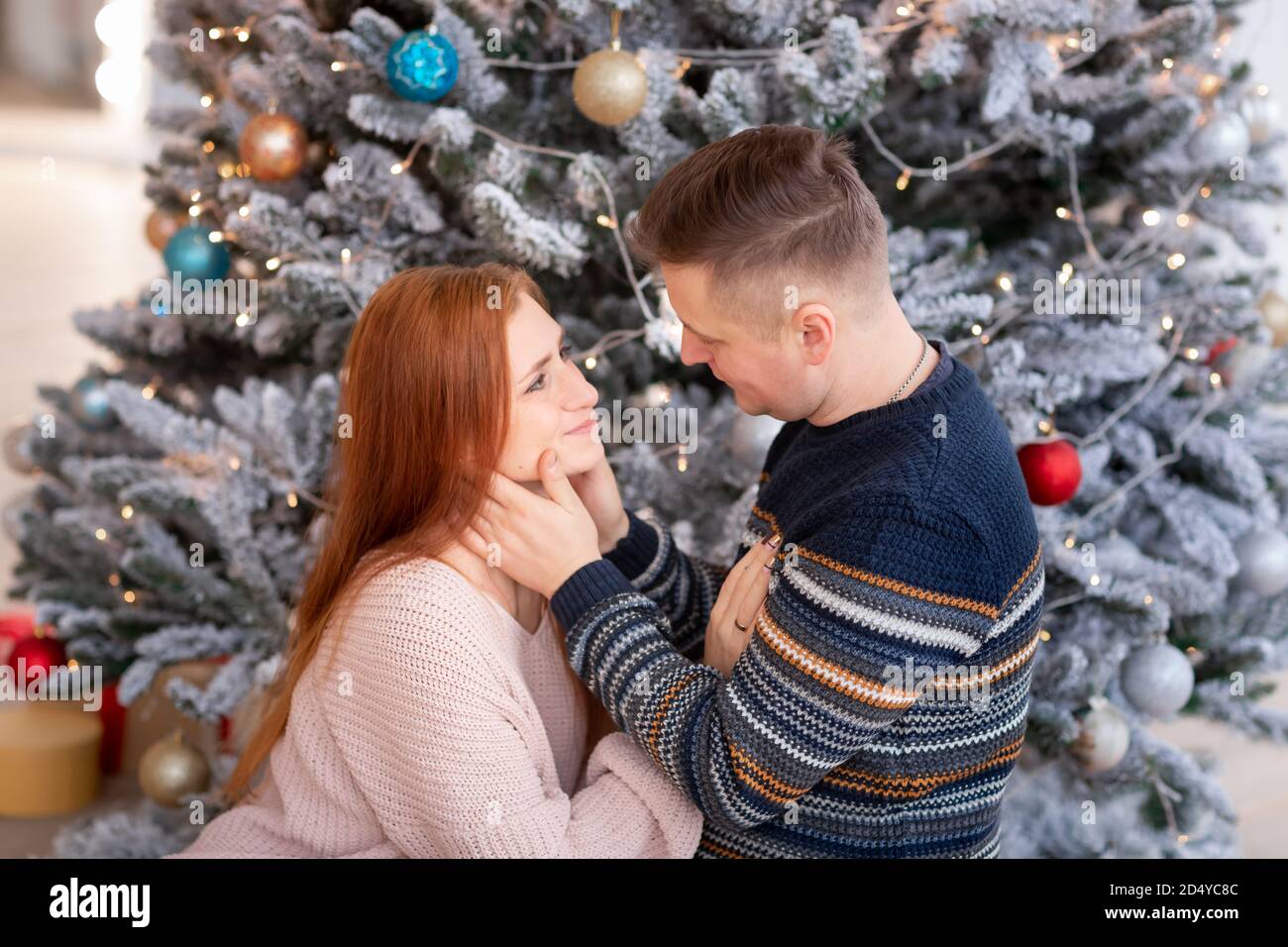 Capturing a happy moment. Beautiful young loving couple bonding to each  other and smiling while making selfie with Christmas Tree in the background  13292958 Stock Photo at Vecteezy