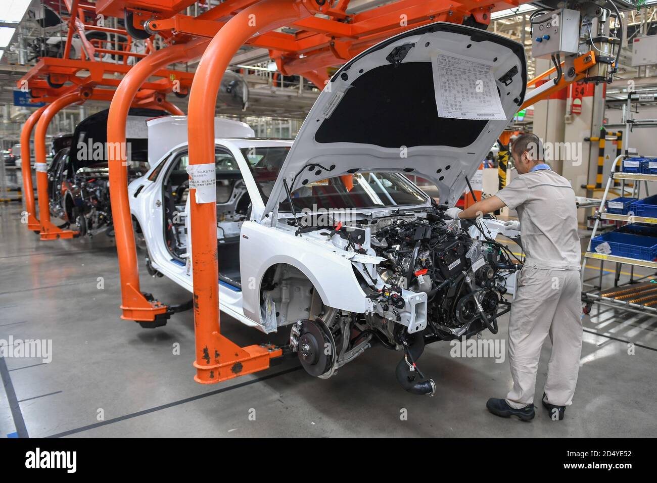 Changchun, China's Jilin Province. 1st Sep, 2020. A worker assembles a car at a factory of the First Automotive Works (FAW) Group Co., Ltd. in Changchun, capital of northeast China's Jilin Province, Sept. 1, 2020. China's leading automaker First Automotive Works (FAW) Group Co., Ltd. sold 2,656,744 vehicles in the first three quarters of the year, up 8 percent year on year, according to corporate sources. Credit: Zhang Nan/Xinhua/Alamy Live News Stock Photo