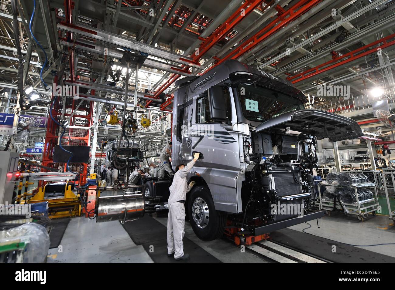 Changchun, China's Jilin Province. 23rd Sep, 2020. Workers assemble vehicles at a factory of the First Automotive Works (FAW) Group Co., Ltd. in Changchun, capital of northeast China's Jilin Province, Sept. 23, 2020. China's leading automaker First Automotive Works (FAW) Group Co., Ltd. sold 2,656,744 vehicles in the first three quarters of the year, up 8 percent year on year, according to corporate sources. Credit: Zhang Nan/Xinhua/Alamy Live News Stock Photo
