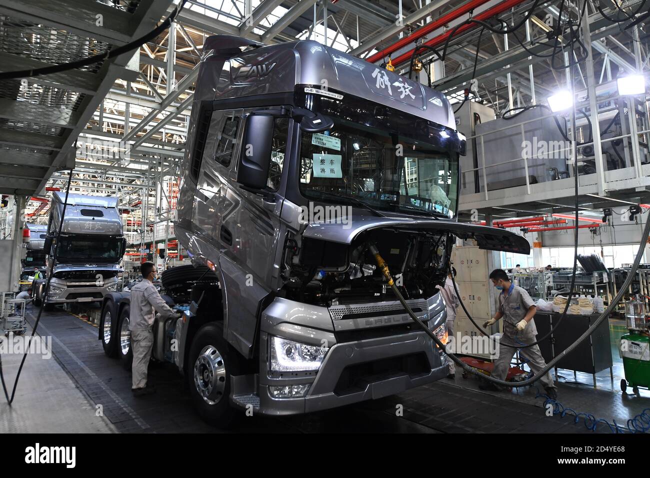 Changchun, China's Jilin Province. 23rd Sep, 2020. Workers assemble vehicles at a factory of the First Automotive Works (FAW) Group Co., Ltd. in Changchun, capital of northeast China's Jilin Province, Sept. 23, 2020. China's leading automaker First Automotive Works (FAW) Group Co., Ltd. sold 2,656,744 vehicles in the first three quarters of the year, up 8 percent year on year, according to corporate sources. Credit: Zhang Nan/Xinhua/Alamy Live News Stock Photo