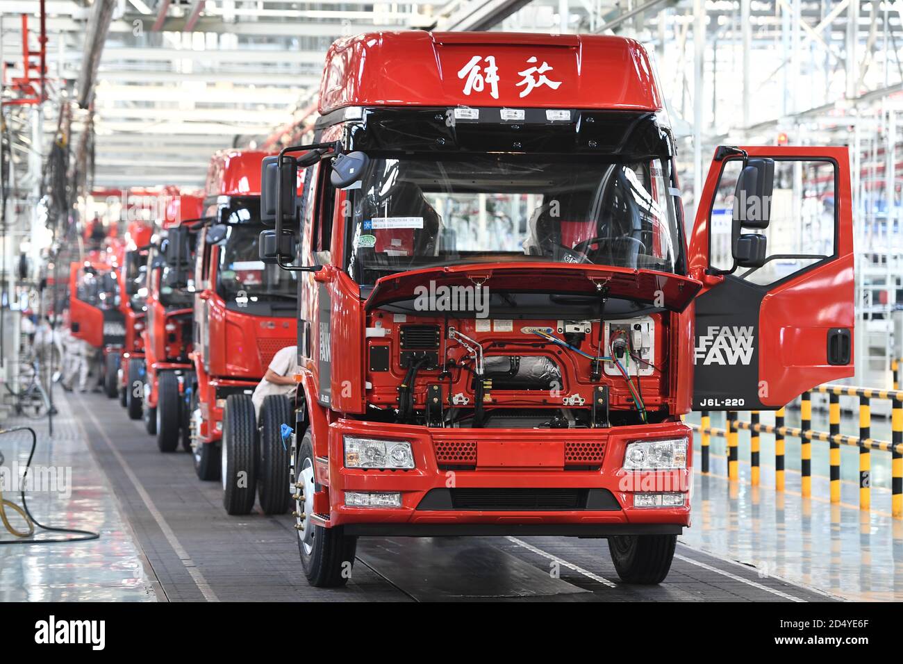 Changchun, China's Jilin Province. 23rd Sep, 2020. Vehicles wait for assembling at a factory of the First Automotive Works (FAW) Group Co., Ltd. in Changchun, capital of northeast China's Jilin Province, Sept. 23, 2020. China's leading automaker First Automotive Works (FAW) Group Co., Ltd. sold 2,656,744 vehicles in the first three quarters of the year, up 8 percent year on year, according to corporate sources. Credit: Zhang Nan/Xinhua/Alamy Live News Stock Photo