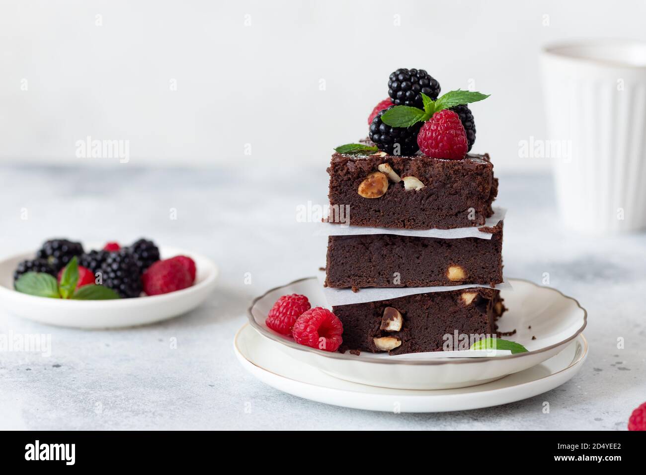 stack of chocolate brownies with raspberries and blackberries Stock ...