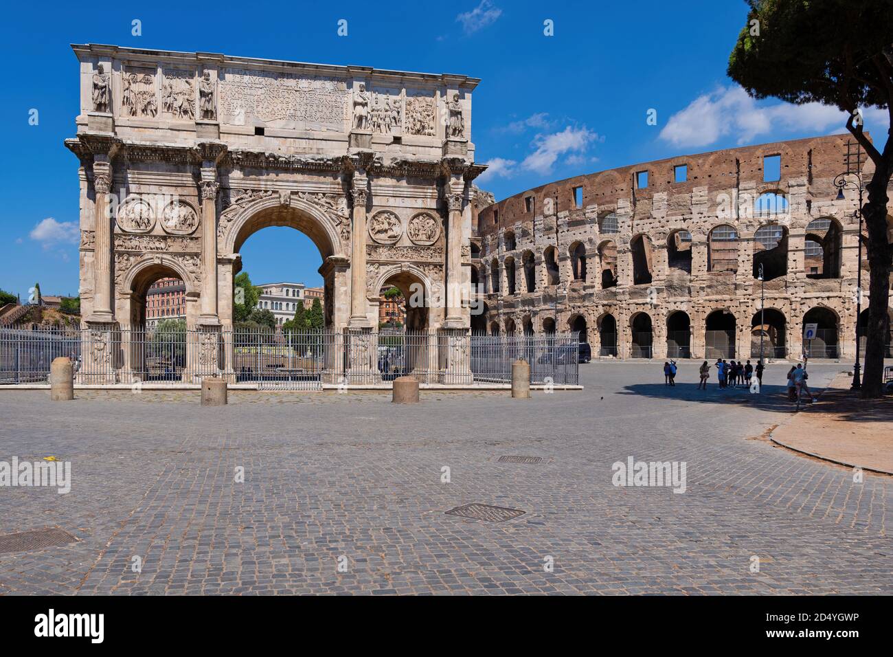 Arch of Constantine and Colosseum in city of Rome, Italy. Ancient city landmarks from Piazza del Arco di Costantino square. Stock Photo