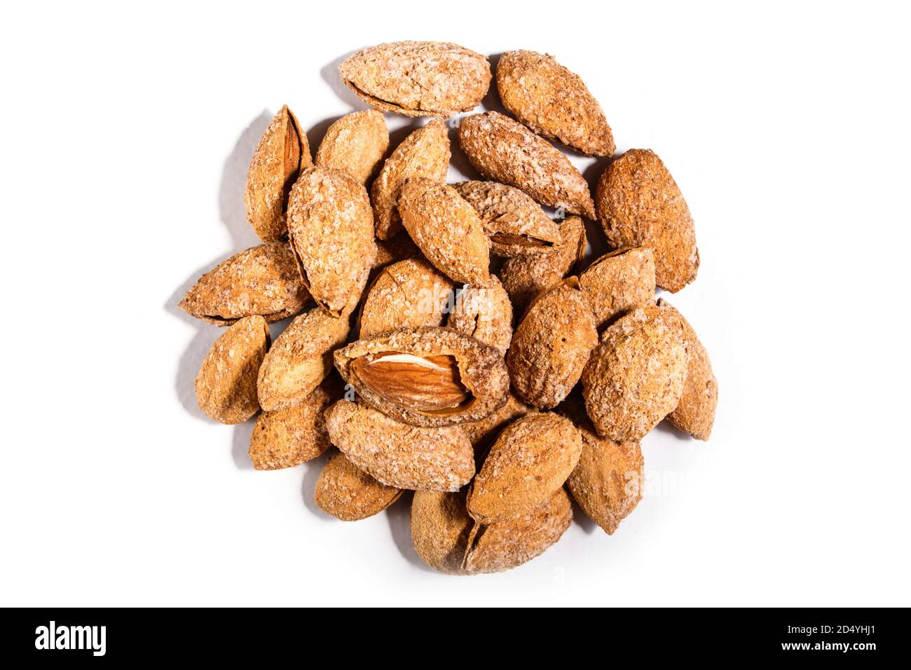 Pile of sweet almond nut with shell and salt isolated on white ...