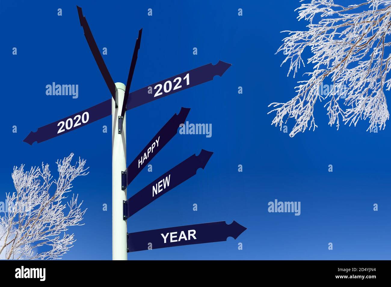 Happy new year 2021 on direction panels, snowy trees Stock Photo