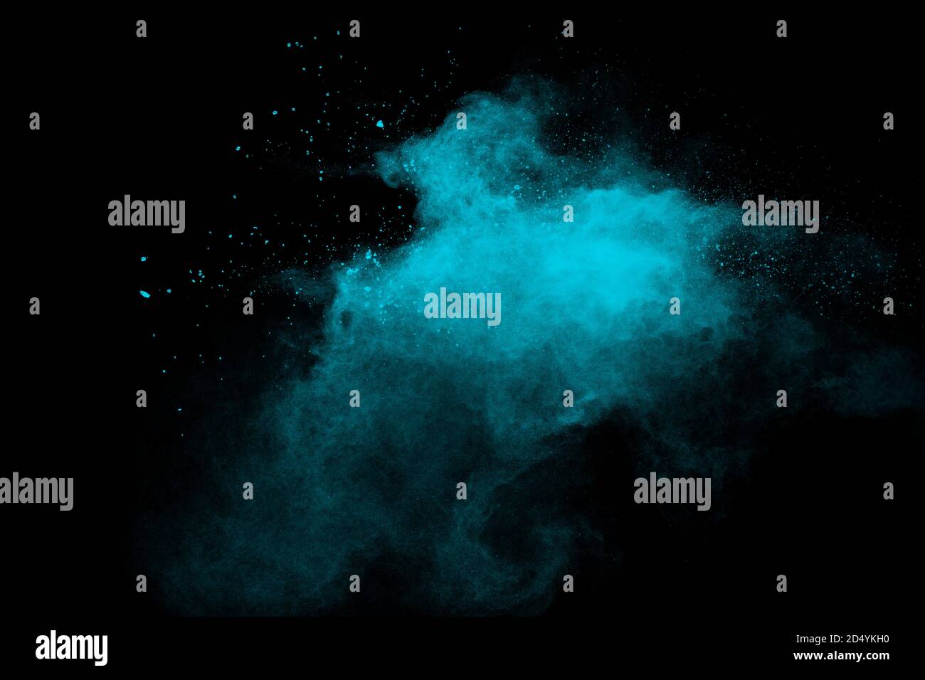 Green color powder explosion cloud on black background.Green dust