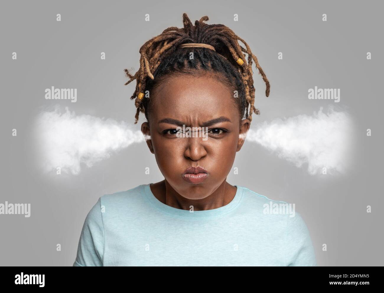 Mad young black lady with steam coming out of ears Stock Photo