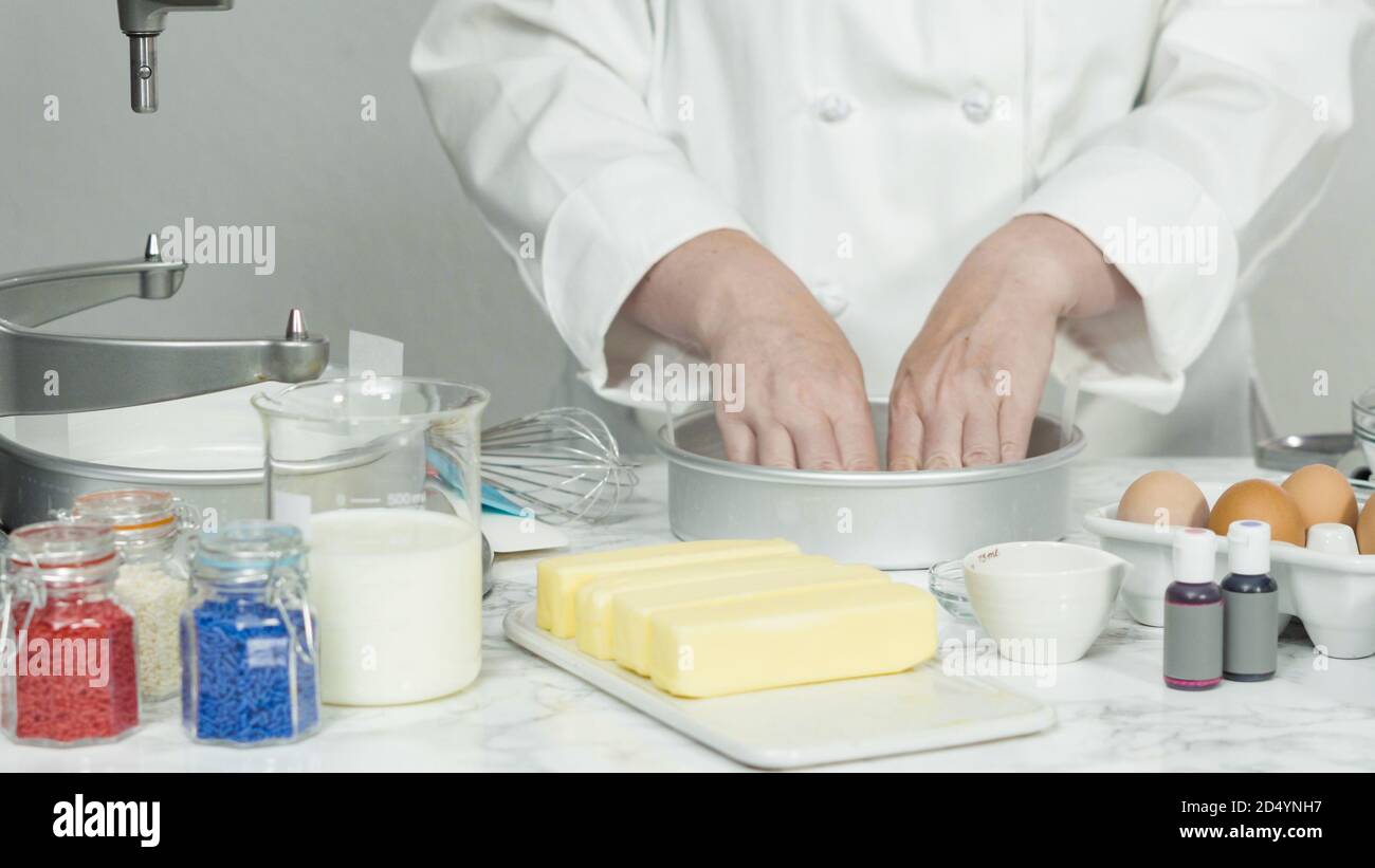 Step by step. Greasing cake pans with butter to bake a threelayer