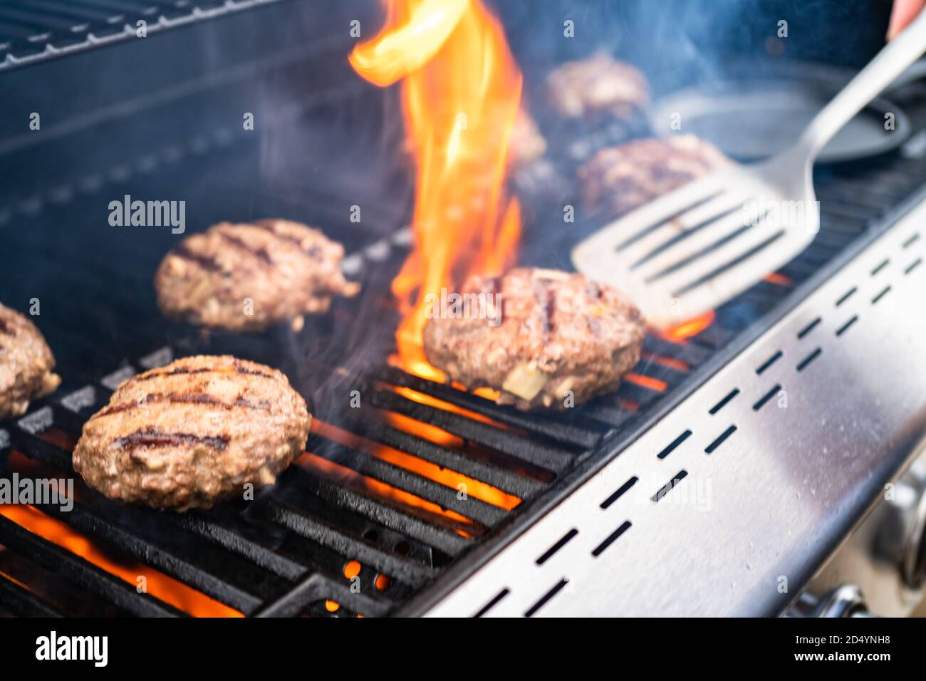 Cooking hamburger beef patties on a gas grill Stock Photo Alamy