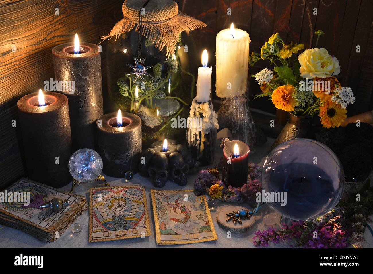 Mysterious still life with old tarot cards, crystal ball and black candles  on witch table. Esoteric, gothic and occult background with magic objects  Stock Photo - Alamy