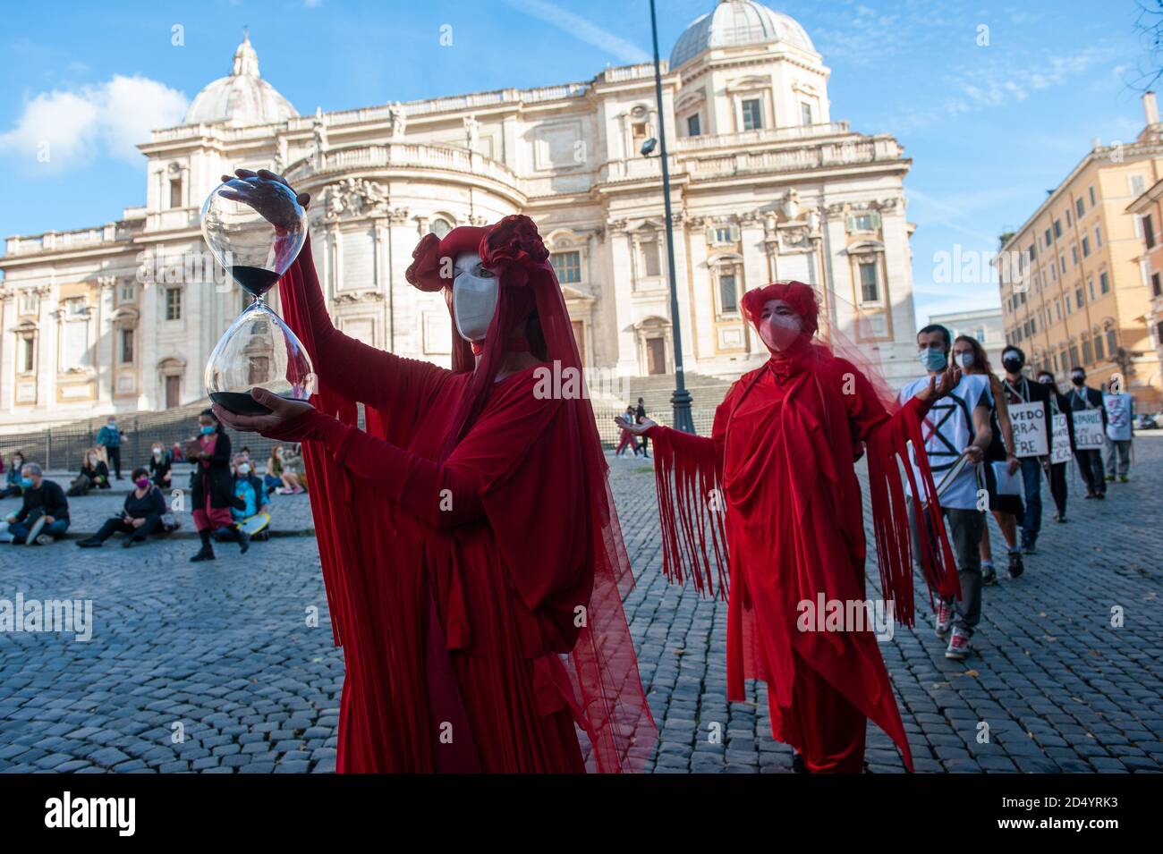 Rome, Italy 10/10/2020: Flash Mob by Extintion Rebellion activists, Piazza Esquilino. © Andrea Sabbadini Stock Photo