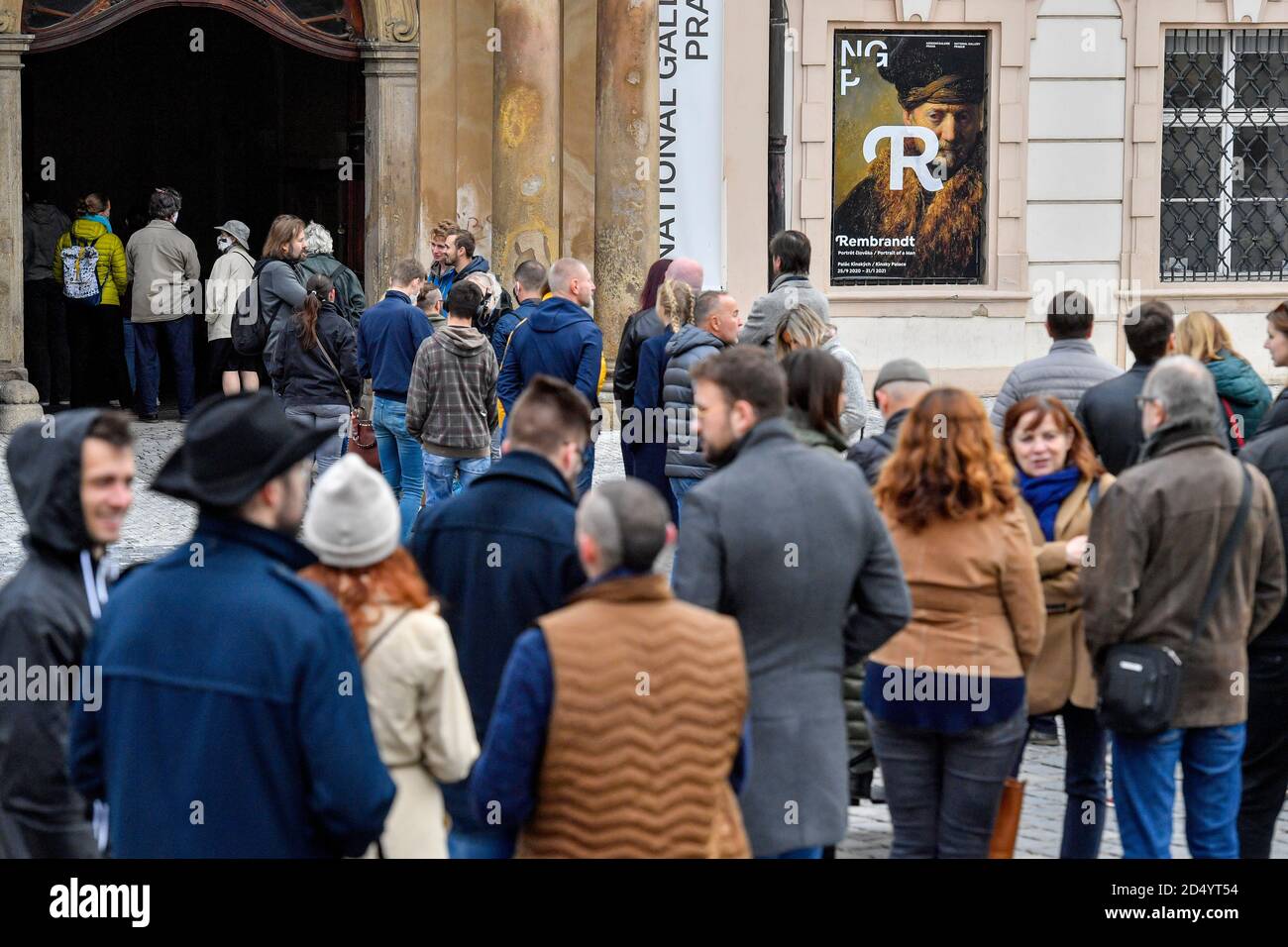 People stand queue for the exhibition of works by Rembrandt van Rijn (1606-1669), 'Rembrandt: Portrait of a Man', organising National Gallery (NGP) in the Kinsky Palace in Prague, on Sunday, October 11, 2020, prior its tomorrow's closing. The new measures against the novel coronavirus spread will take effect in the Czech Republic as of Wednesday, October 14 and the government will decide on them on Monday, Prime Minister Andrej Babis (ANO) said in his regular Sunday presentation on his Facebook profile today. The government decided on Thursday that heritage sights, theatres and cinemas, museum Stock Photo