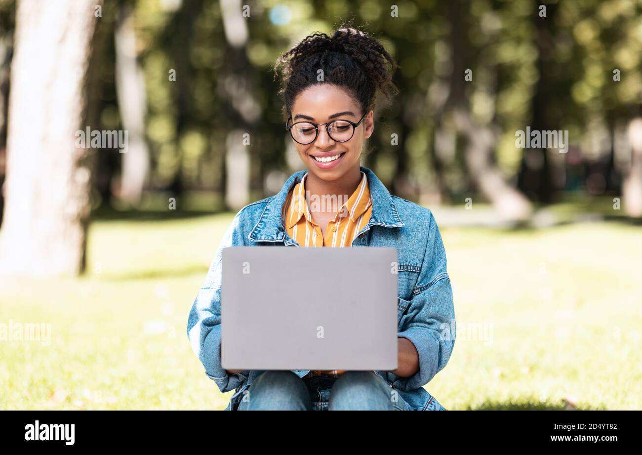 African American Female Student Using Laptop Learning Online Sitting ...