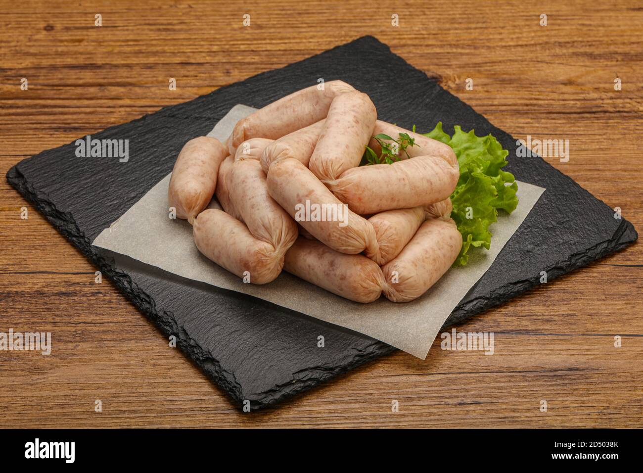Raw natural chicken baby sausages for roast Stock Photo Alamy