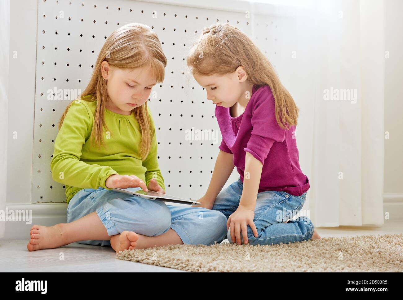 happy children holding digital tablet Stock Photo - Alamy