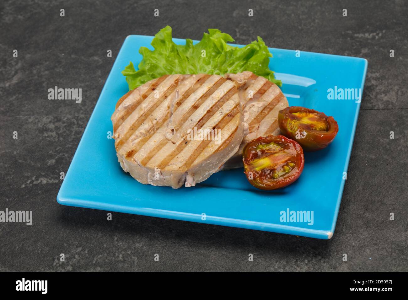 Grilled tuna steak with kumato and salad Stock Photo Alamy