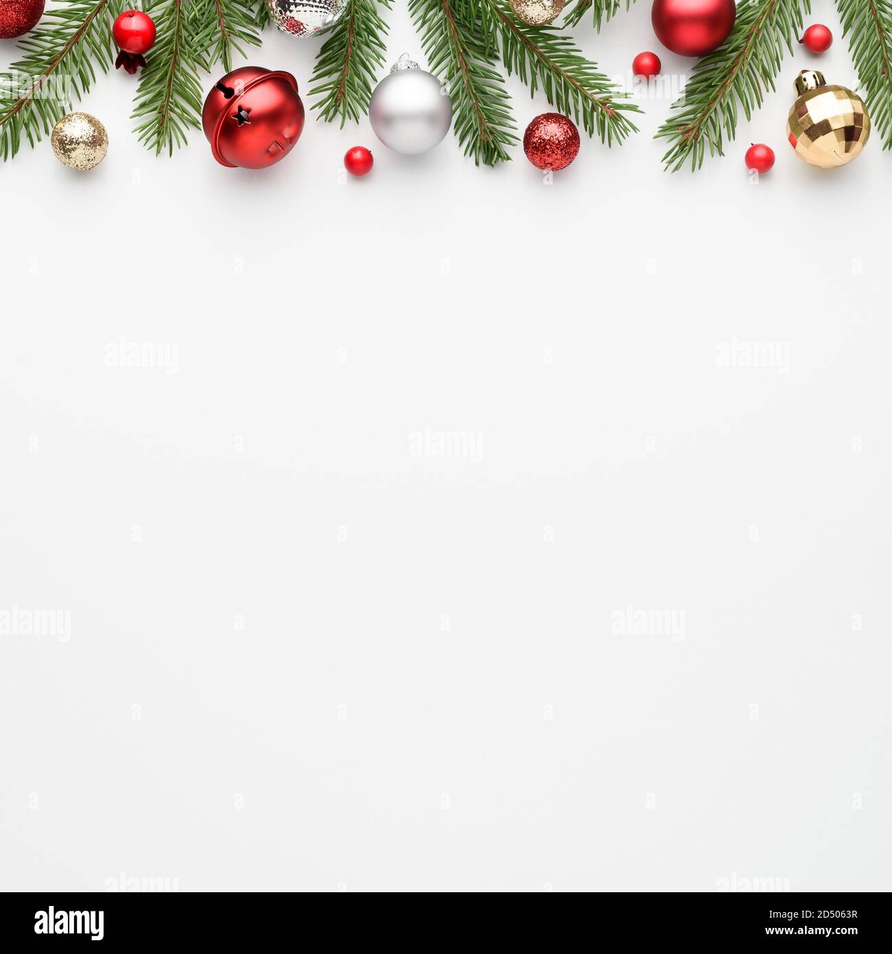 Square christmas card with fir decorations on white background. Festive border with copy space for advertising text. Top view, flat lay Stock Photo