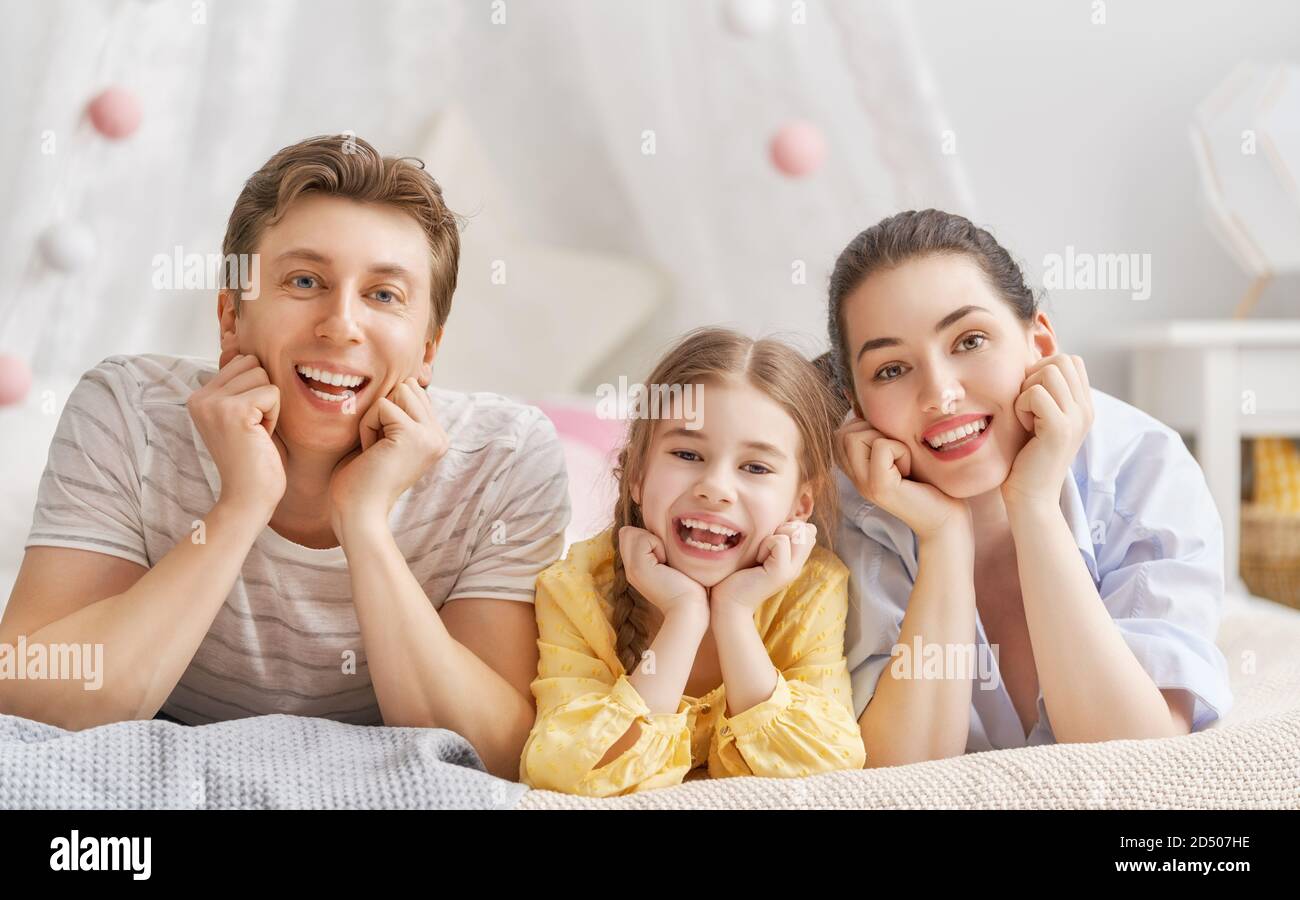 Happy family. Child daughter with father and mother. Mum, dad and girl ...