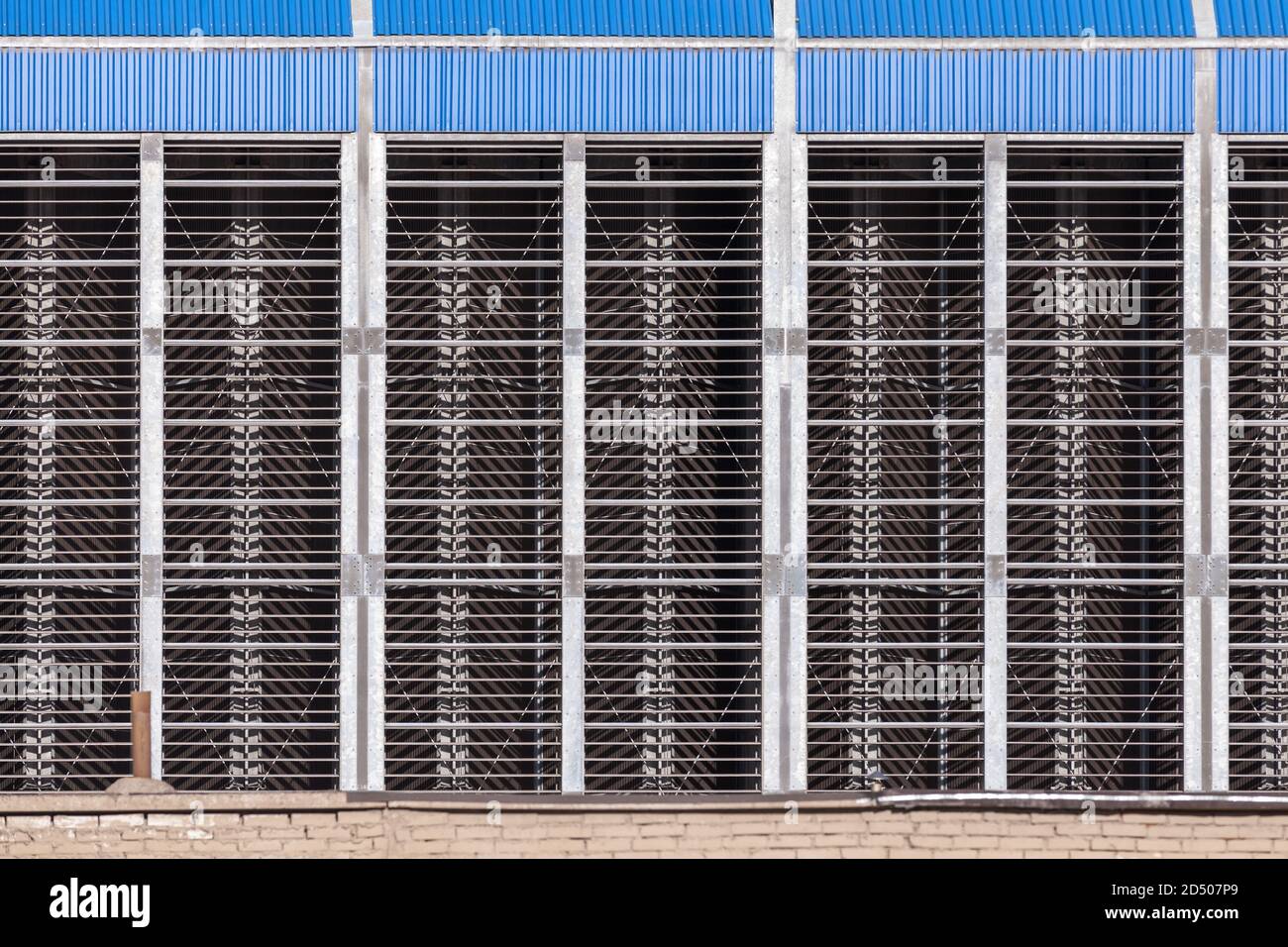 Industrial metal wall with cooling grates, flat background photo texture Stock Photo