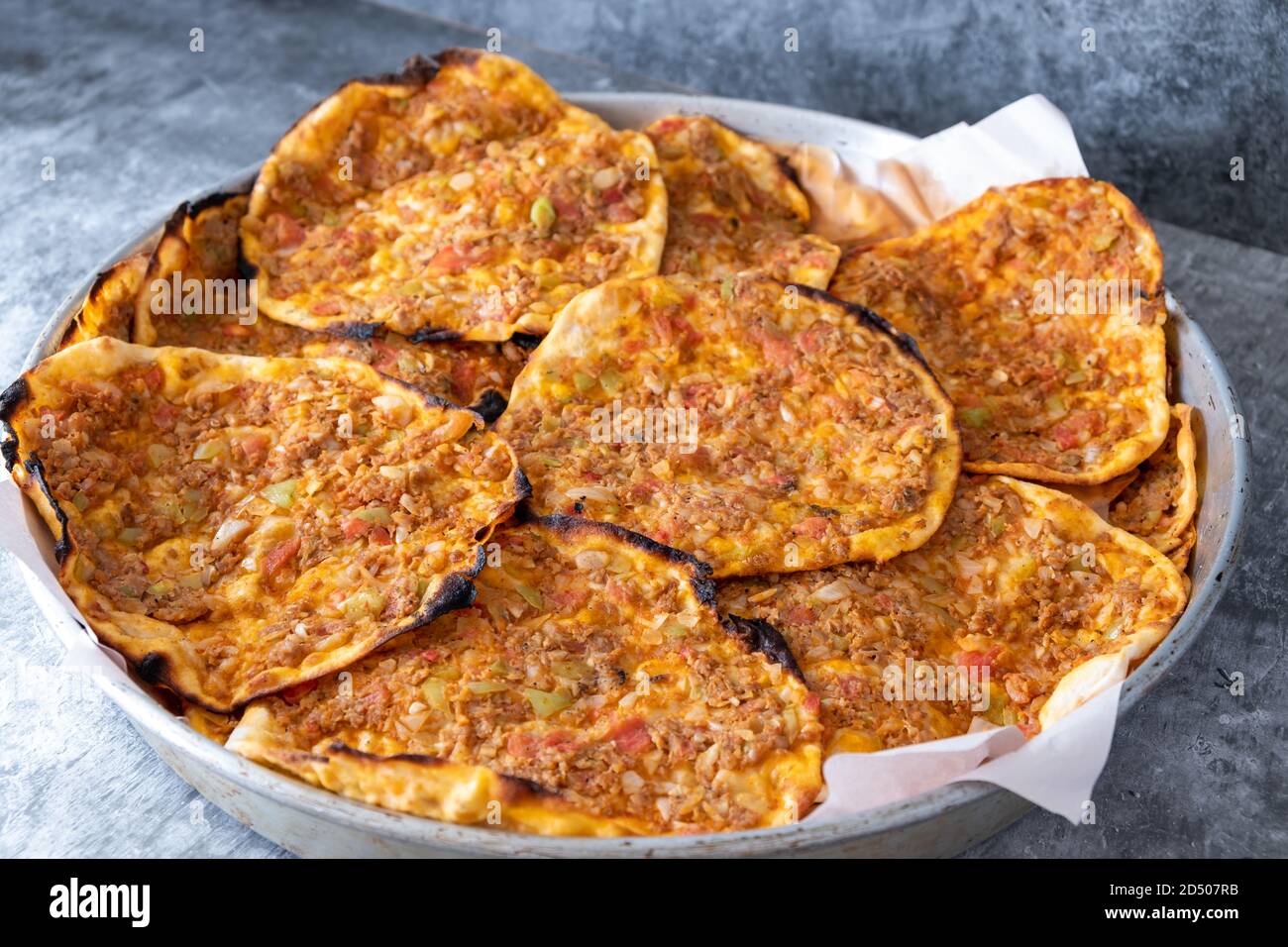 Traditional delicious Turkish foods; Lahmacun (Turkish pizza). Homemade lahmacun during the lockdown Stock Photo