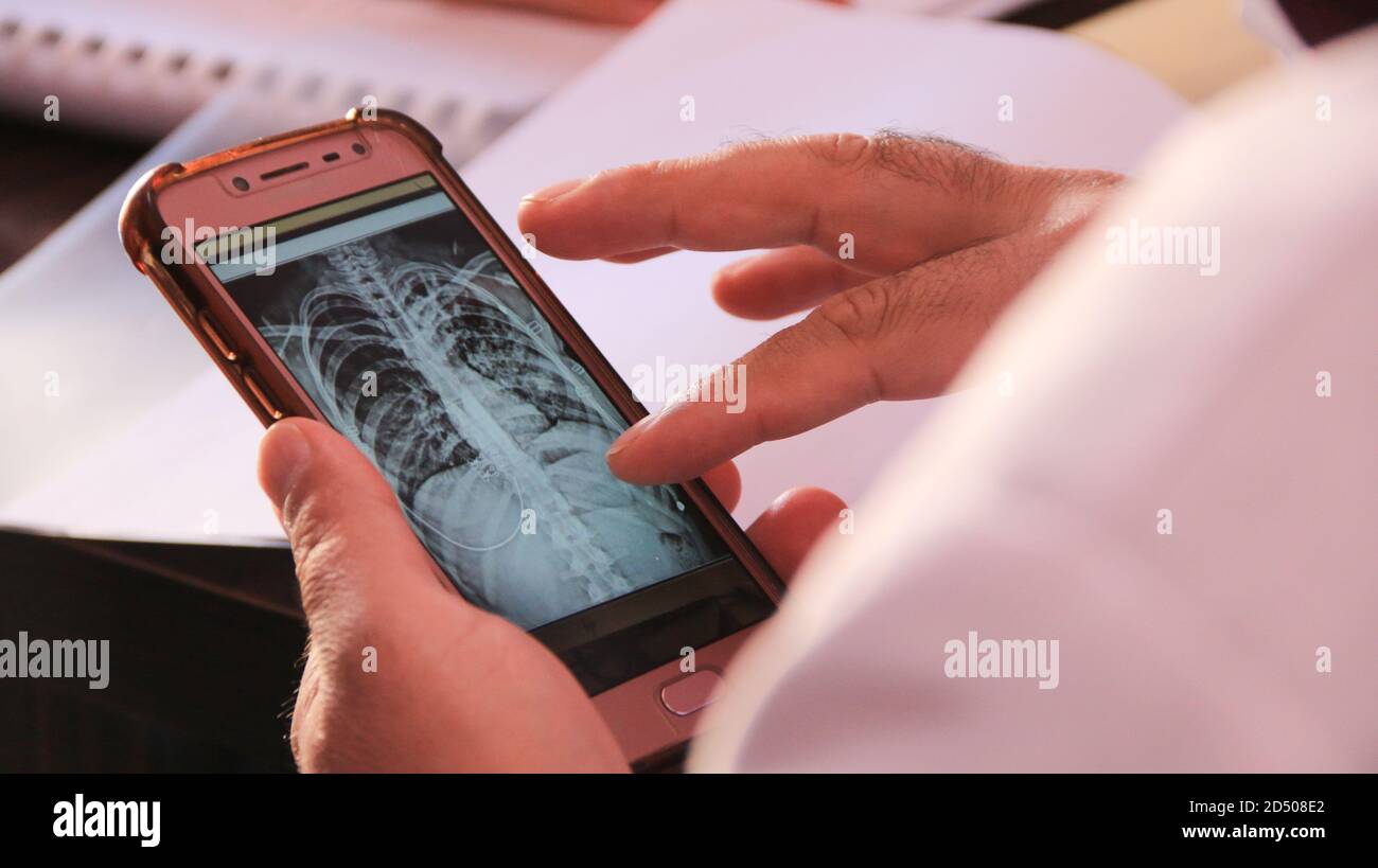 Hospital Radiographer With male Patient Operating CT Scanner Stock ...