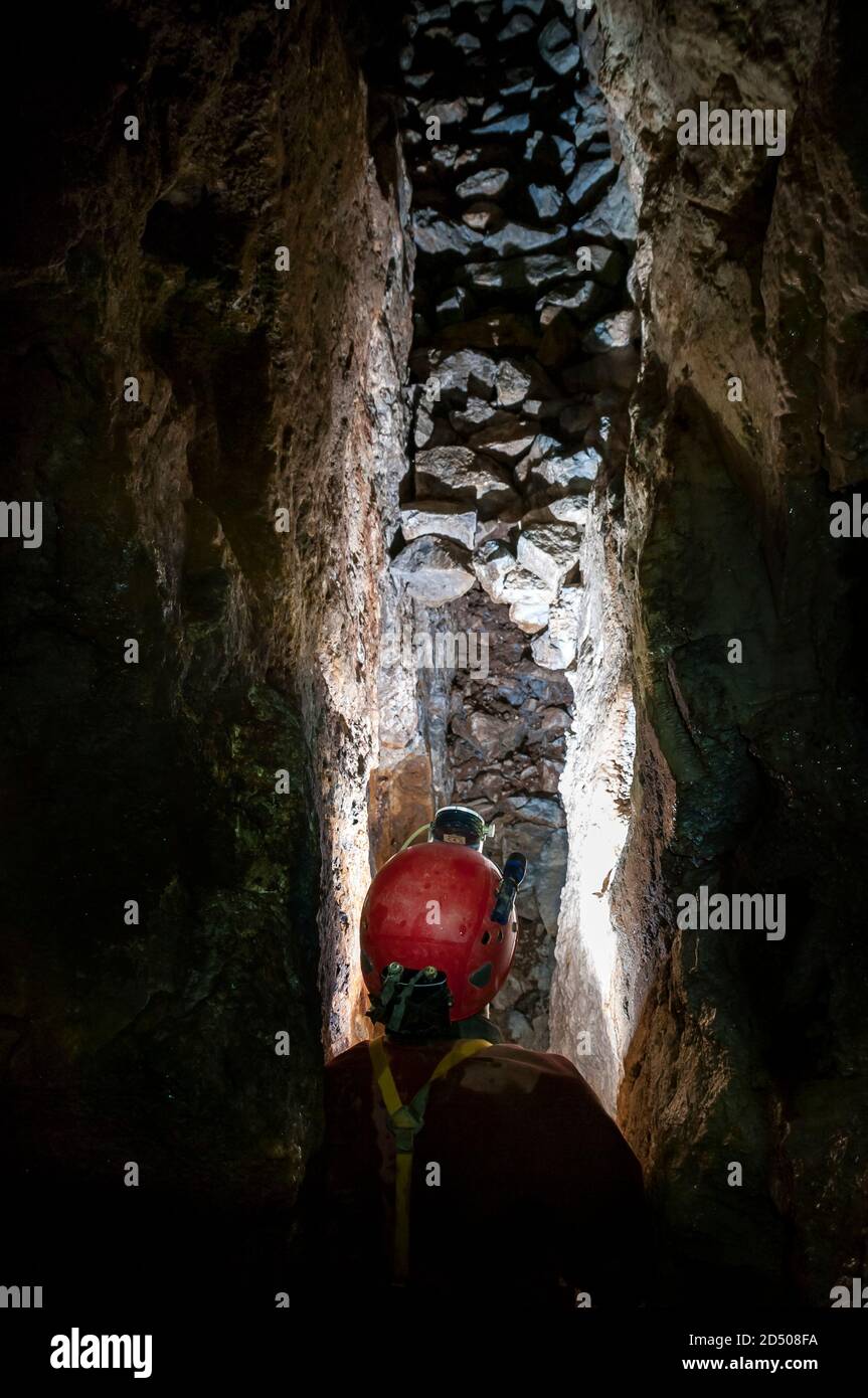 Waste rock stored in a rift passage created by removal of the mineral