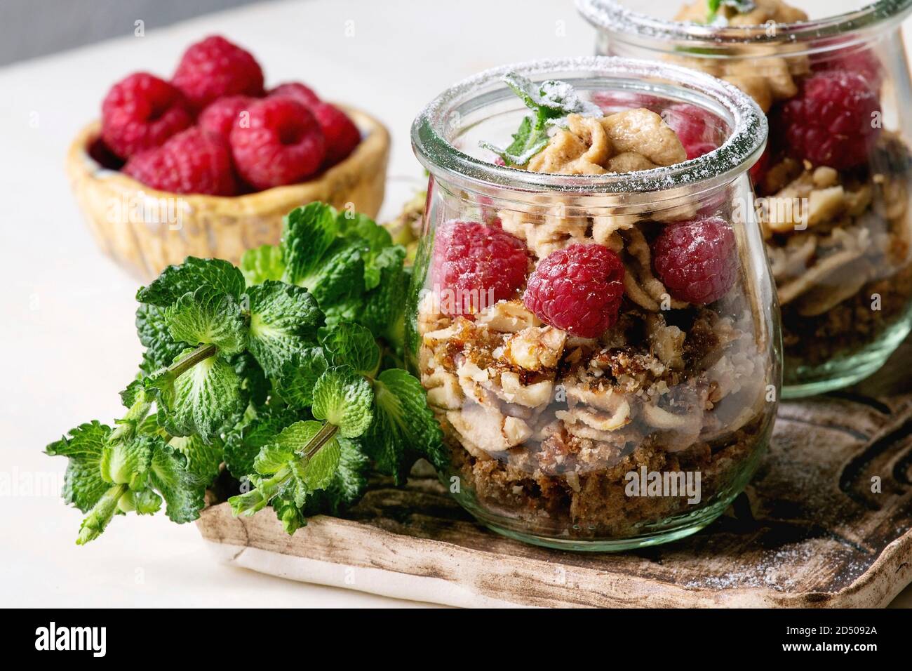 Layered Dessert In Jars Biscuit Coffee Cream Nuts Raspberries Fresh Mint Served On Ceramic Tray With Berries And Greens Over White Marble Table Stock Photo Alamy Layered Dessert In Jars Biscuit Coffee Cream Nuts Raspberries Fresh Mint Served On Ceramic Tray With Berries And Greens Over White Marble Table Stock Photo Alamy