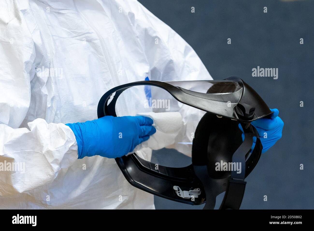 Bad Essen, Germany October 11, 2020: Corona outbreak - Vitalis Wohnpark Bad Essen Health Department is testing in Bad Essen after the Corona outbreak in the Vitalis Wohnpark. Cleaning the protective visor after a corona test. Feature / symbol / symbol photo / characteristic / detail / | usage worldwide Stock Photo