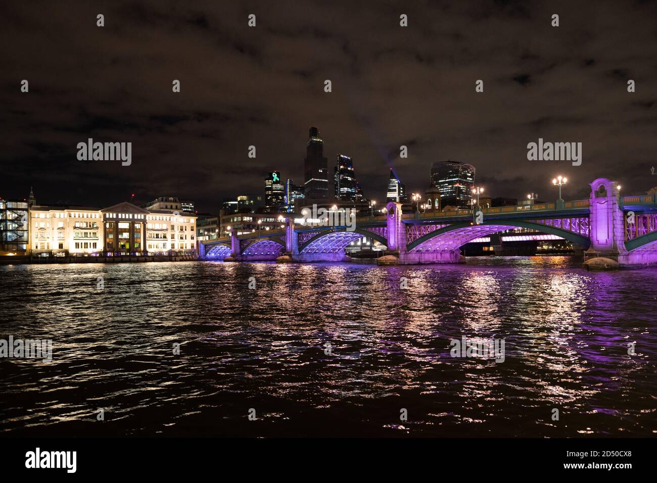 Urban tourism and skyline at night with illuminated light bridges hi ...