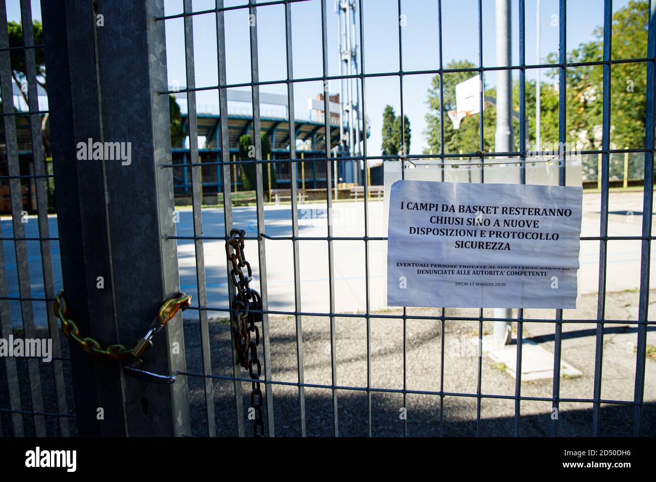 Notice outside a playground that warns of the closure of the playing area due to the covid restrictions in Bologna (Italy) on 18 July 2020 Stock Photo