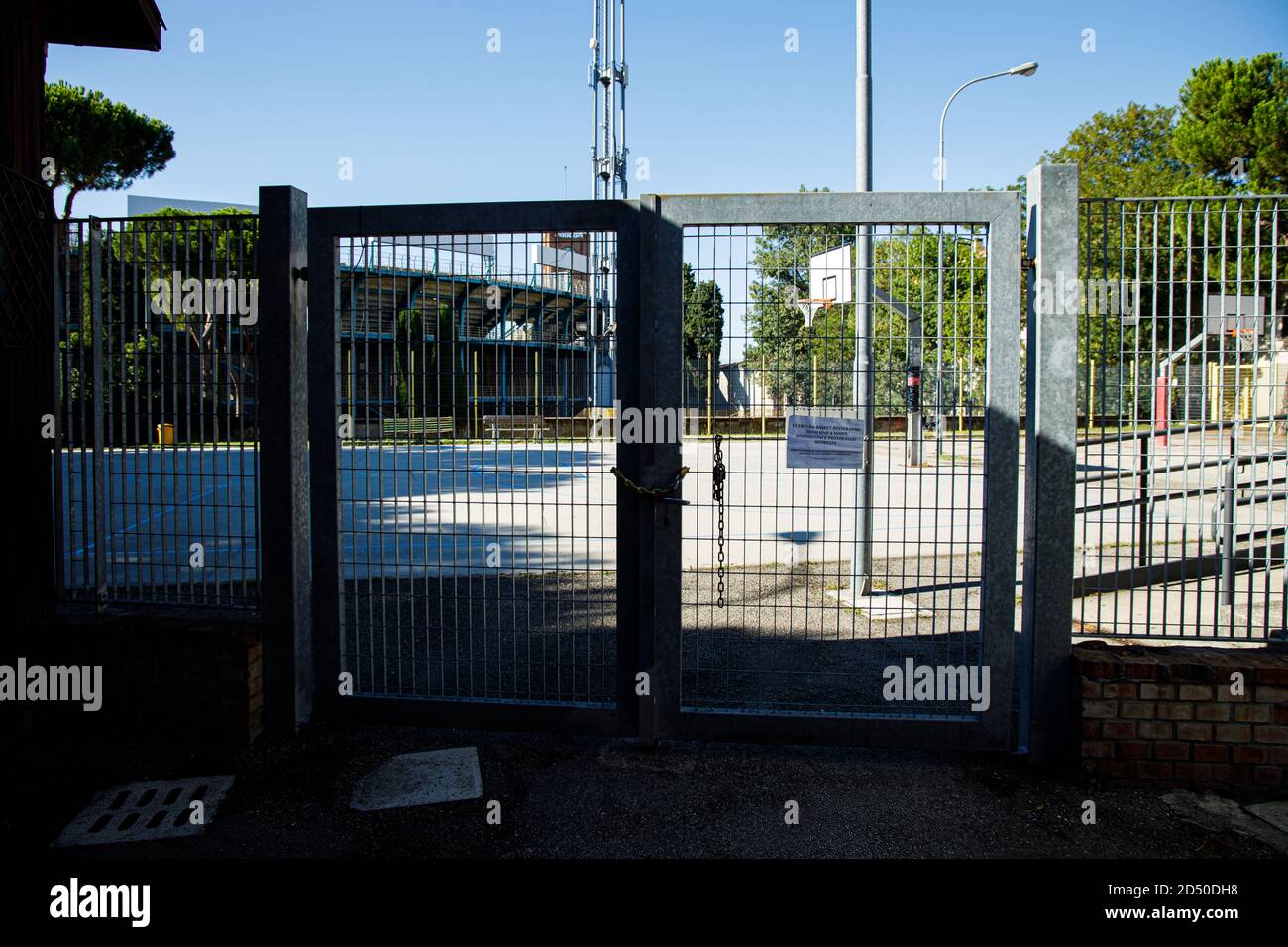 Closed gates of a playground due to covid restrictions in Bologna (Italy) on 18 July 2020 Stock Photo