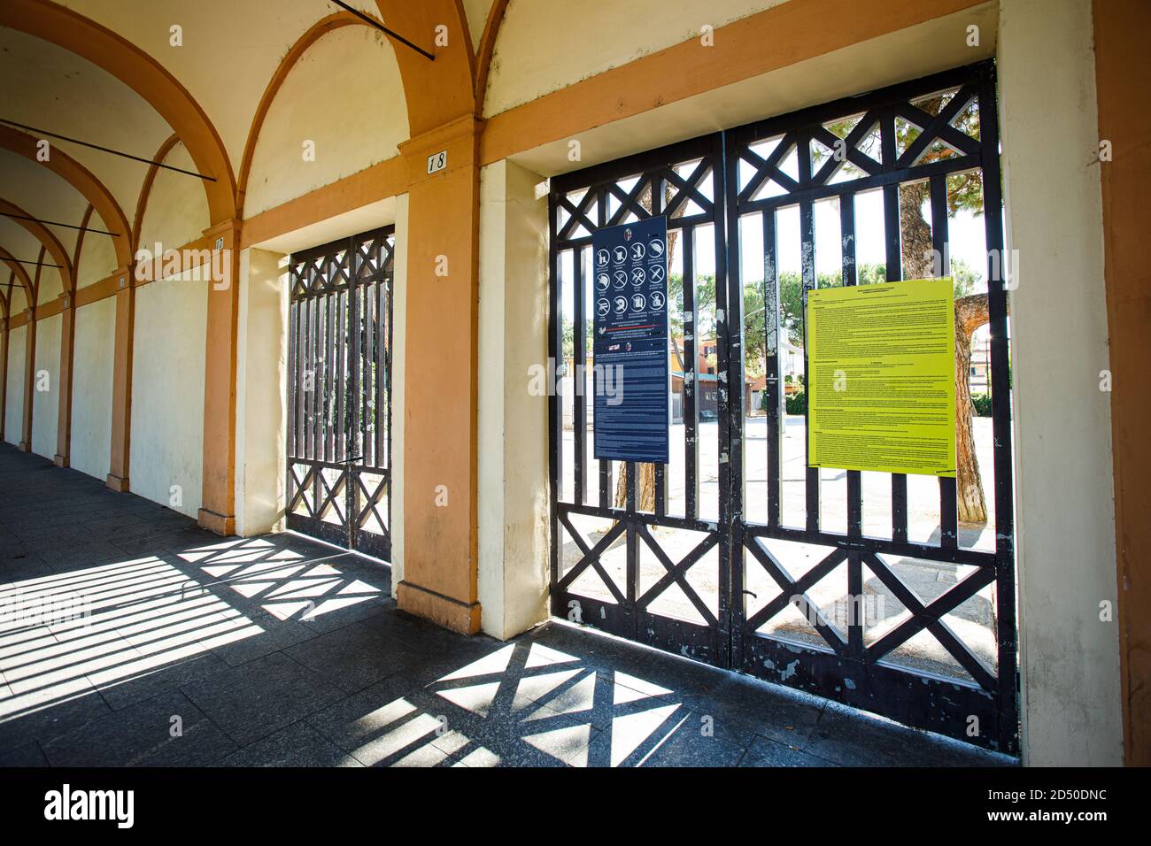 Closed gates of a playground due to covid restrictions in Bologna (Italy) on 18 July 2020 Stock Photo