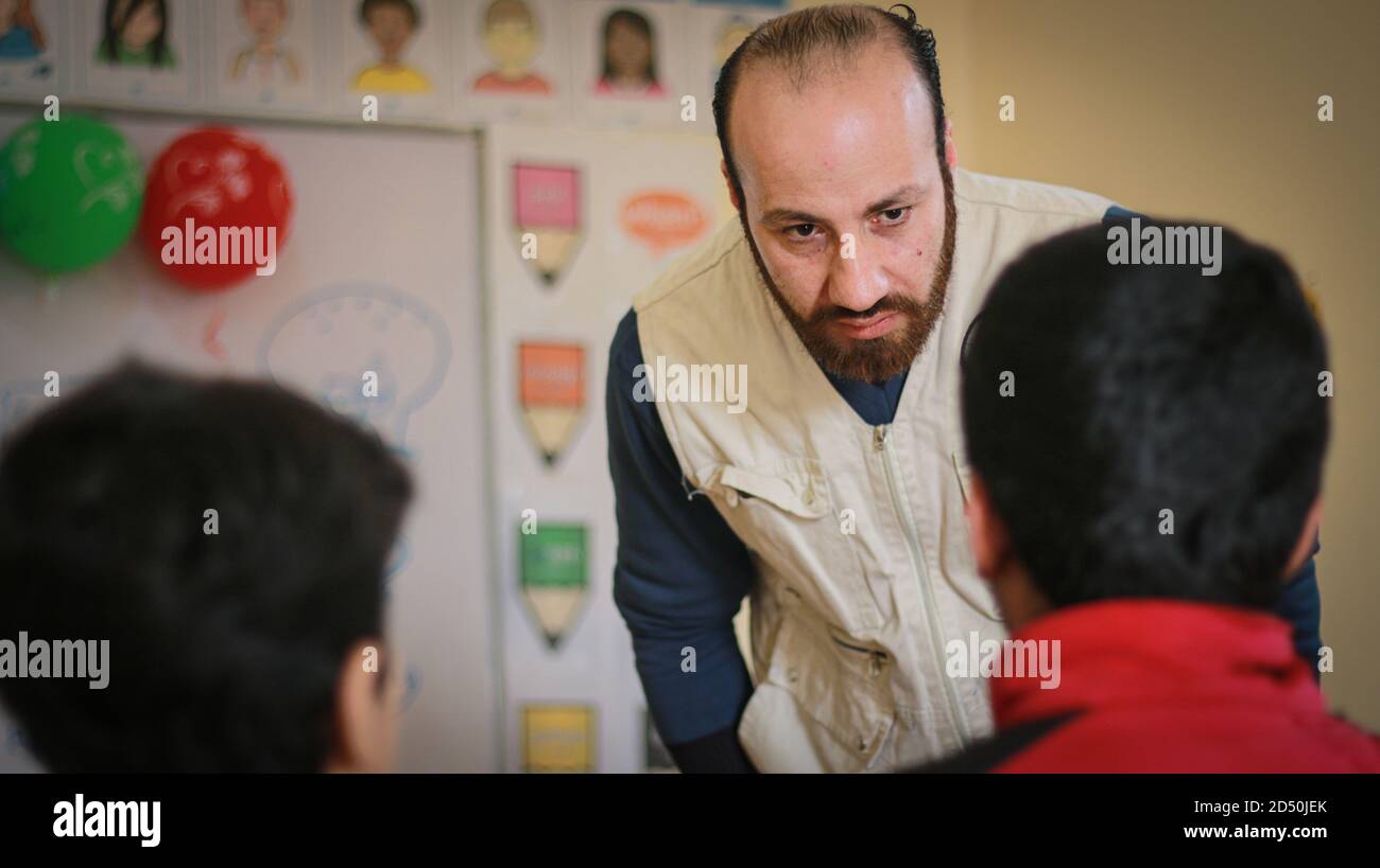 Teacher rebukes a student in the class. Stock Photo