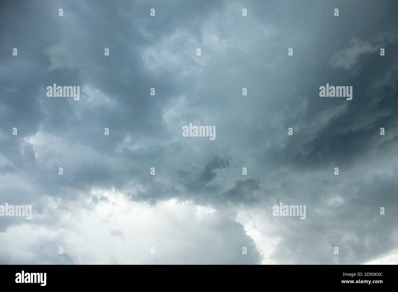 Dark blue or grey clouds look ominous and dark in the sky ready for rain Stock Photo