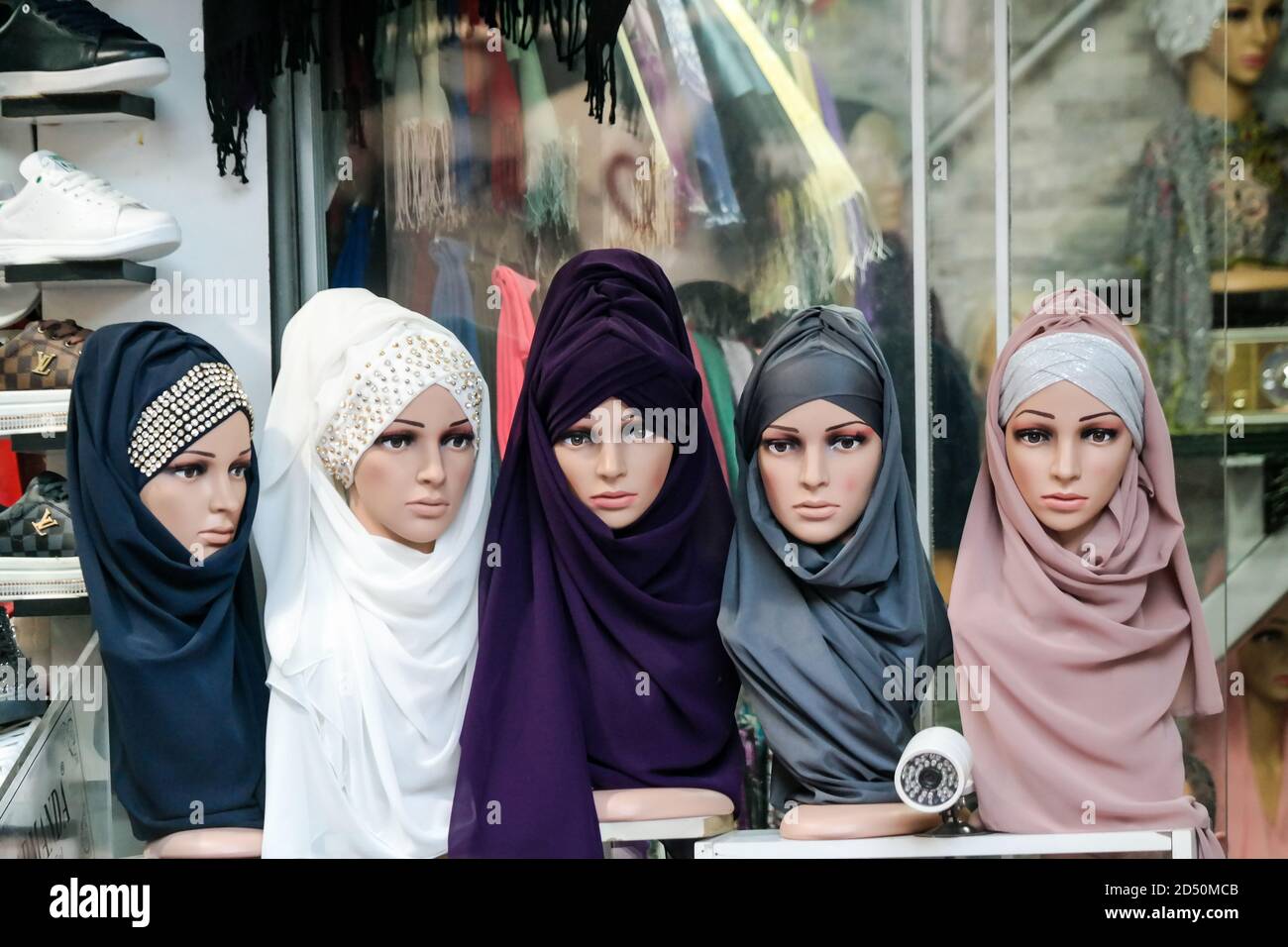Lifeless models for hijab in front of the store in Istanbul. İslamic dresses. Hijabs. Muslim dresses Stock Photo
